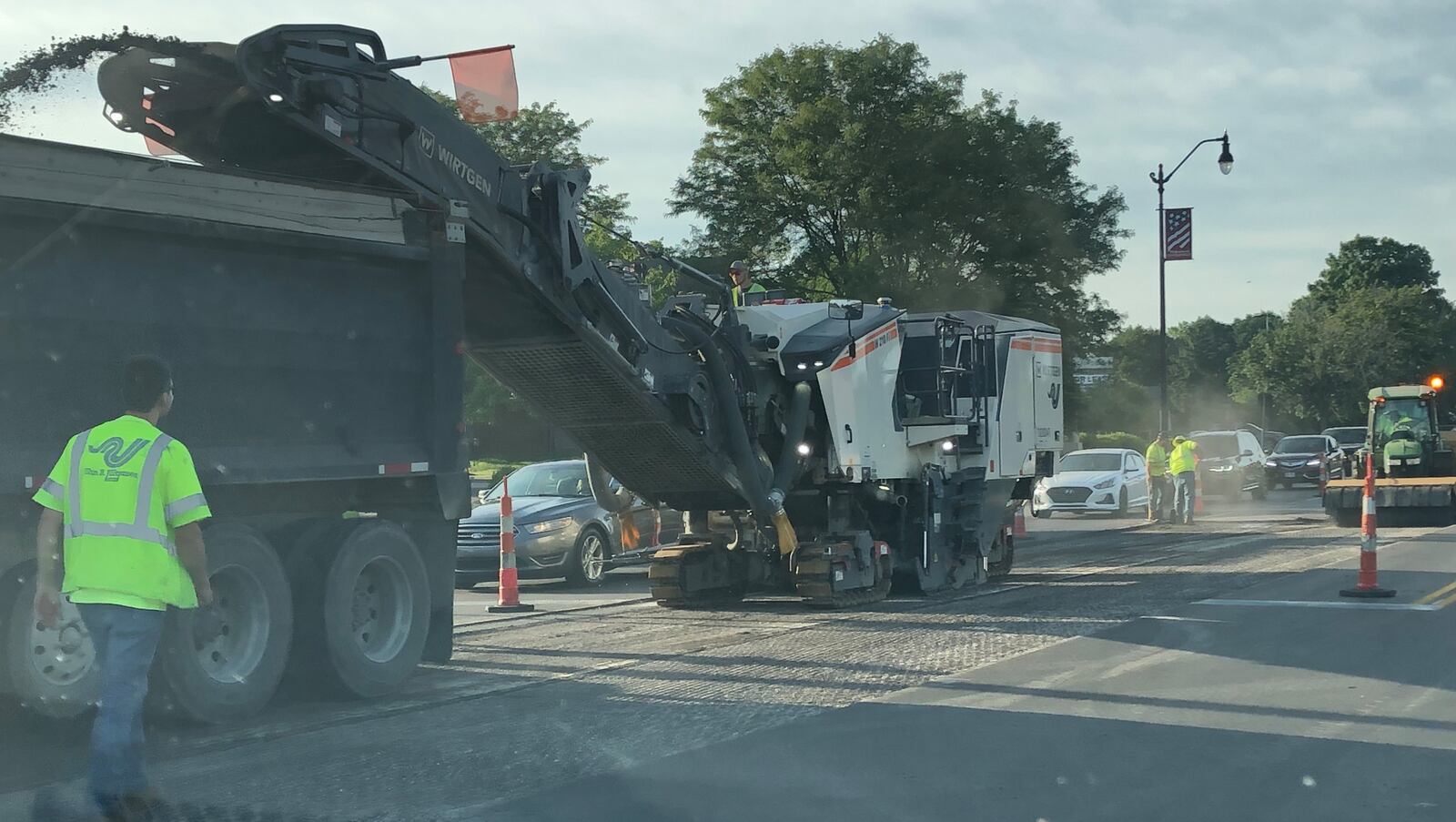 Road crews repave South Main Street near Spring Valley Pike in Centerville on Sunday, June 19, 2022. JEREMY P. KELLEY / STAFF