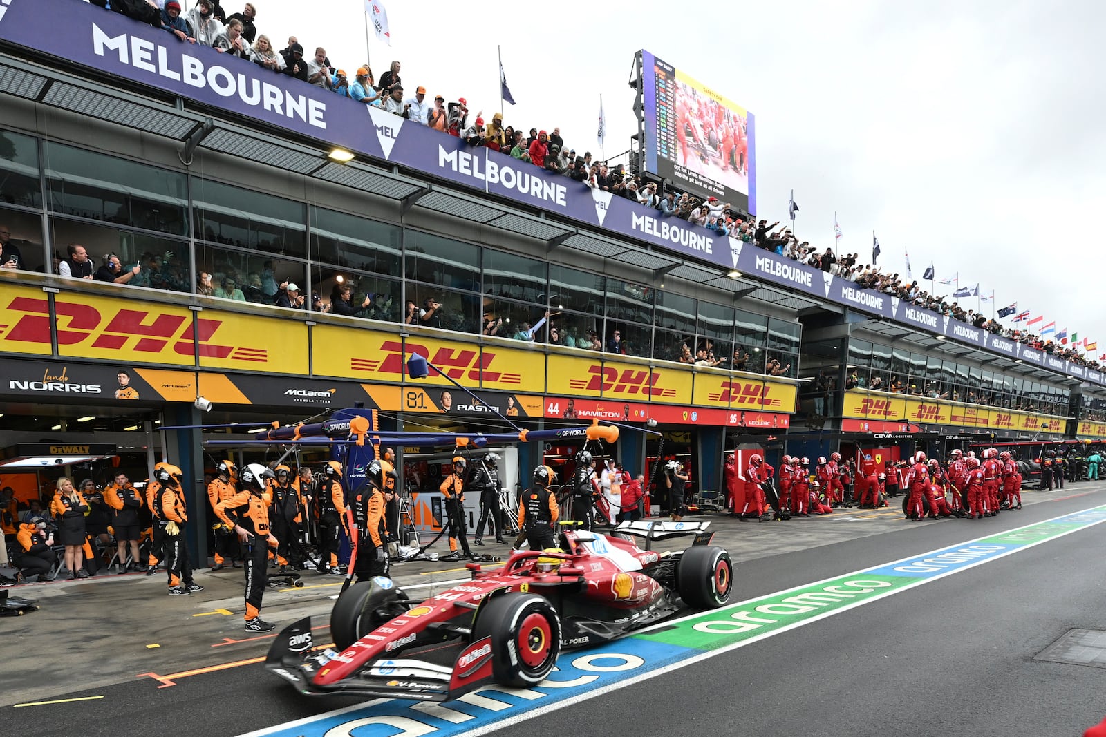 Ferrari driver Lewis Hamilton of Britain steers his car out of pit lane after tire change during the Australian Formula One Grand Prix at Albert Park, in Melbourne, Australia, Sunday, March 16, 2025. (Tracey Nearmy/Pool Photo via AP)