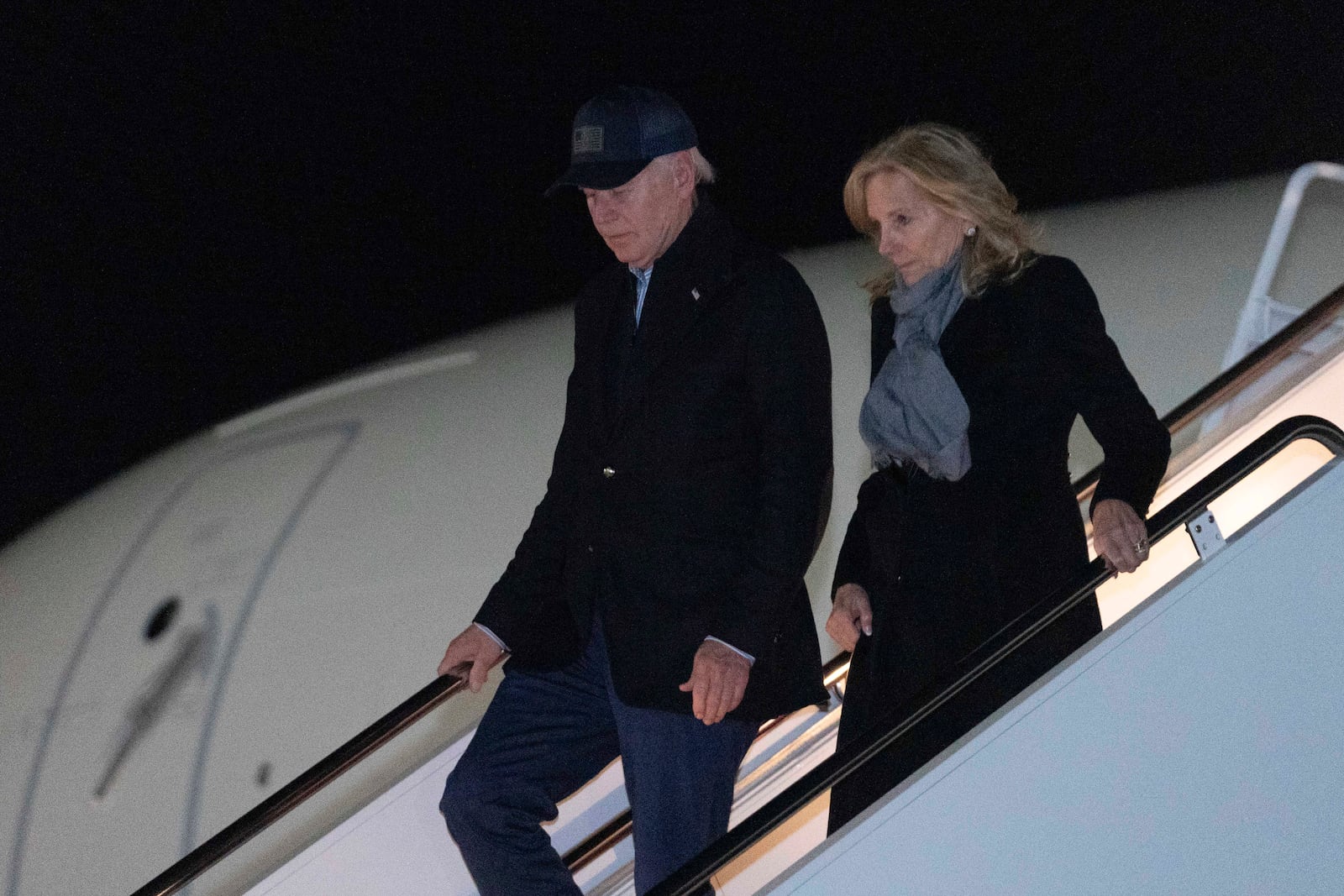 President Joe Biden and first lady Jill Biden step off from Air Force One upon their arrival at Joint Base Andrews, Md., Saturday, Nov. 30, 2024, en route to the White House. (AP Photo/Jose Luis Magana)