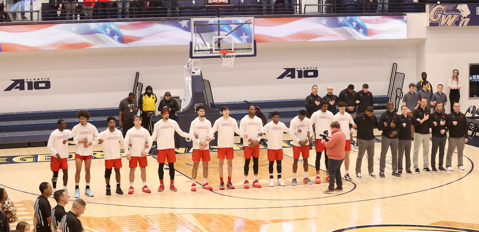 Dayton stands for the national anthem before a game against George Washington on Saturday, Jan. 21, 2023, at the Charles E. Smith Center in Washington, D.C. David Jablonski/Staff