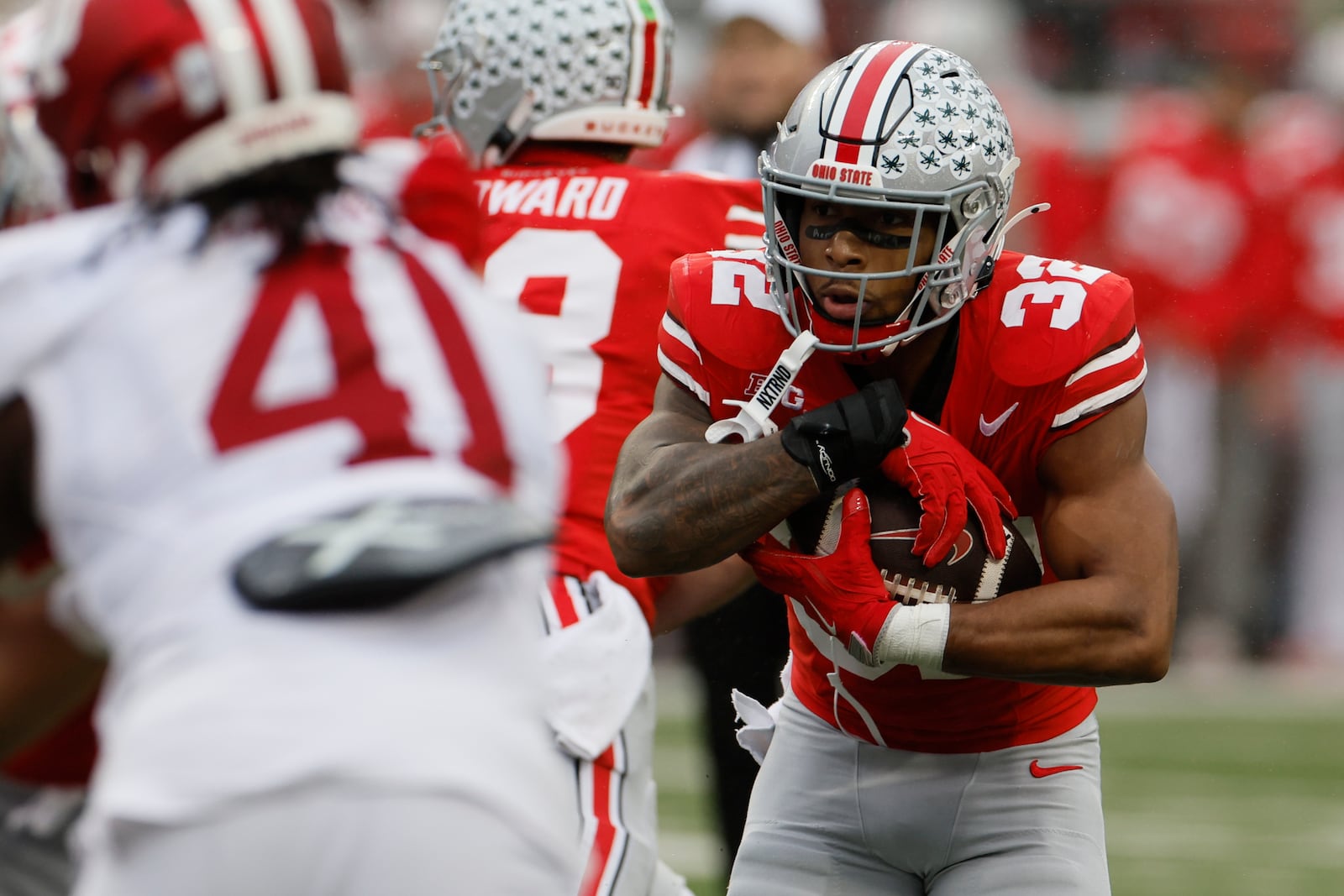 Ohio State running back TreVeyon Henderson runs the ball for a touchdown against Indiana during the first half of an NCAA college football game Saturday, Nov. 23, 2024, in Columbus, Ohio. (AP Photo/Jay LaPrete)