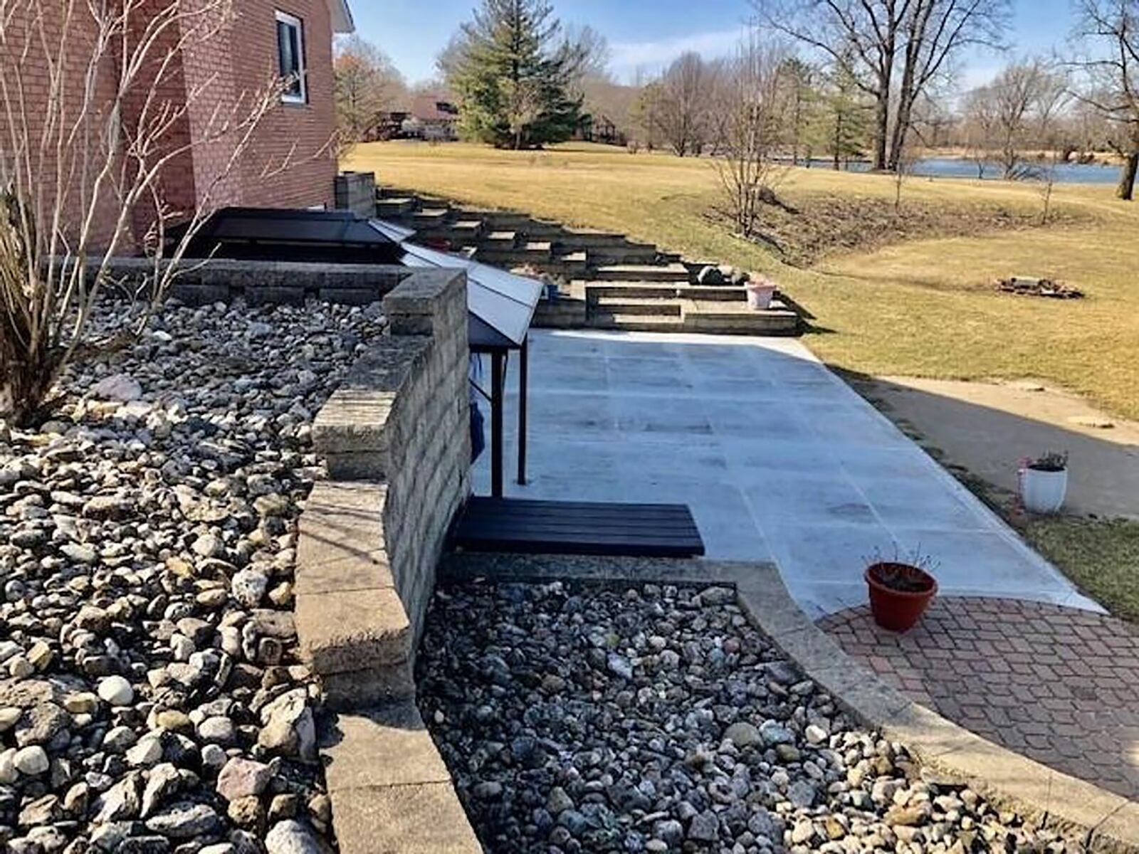 The home has a walk-out basement on the side with a new concrete patio and overlooks Sky Lake (not part of the property).