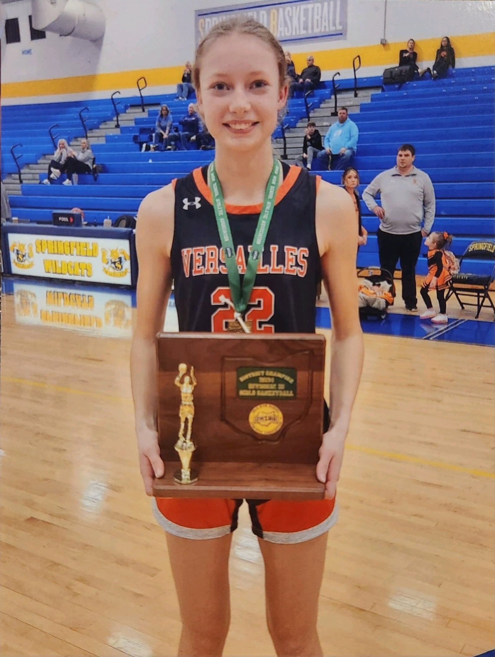 Brooke Bergman with the MVP award she received at the Versailles Lady Tiger Basketball Classic last January.  CONTRIBUTED