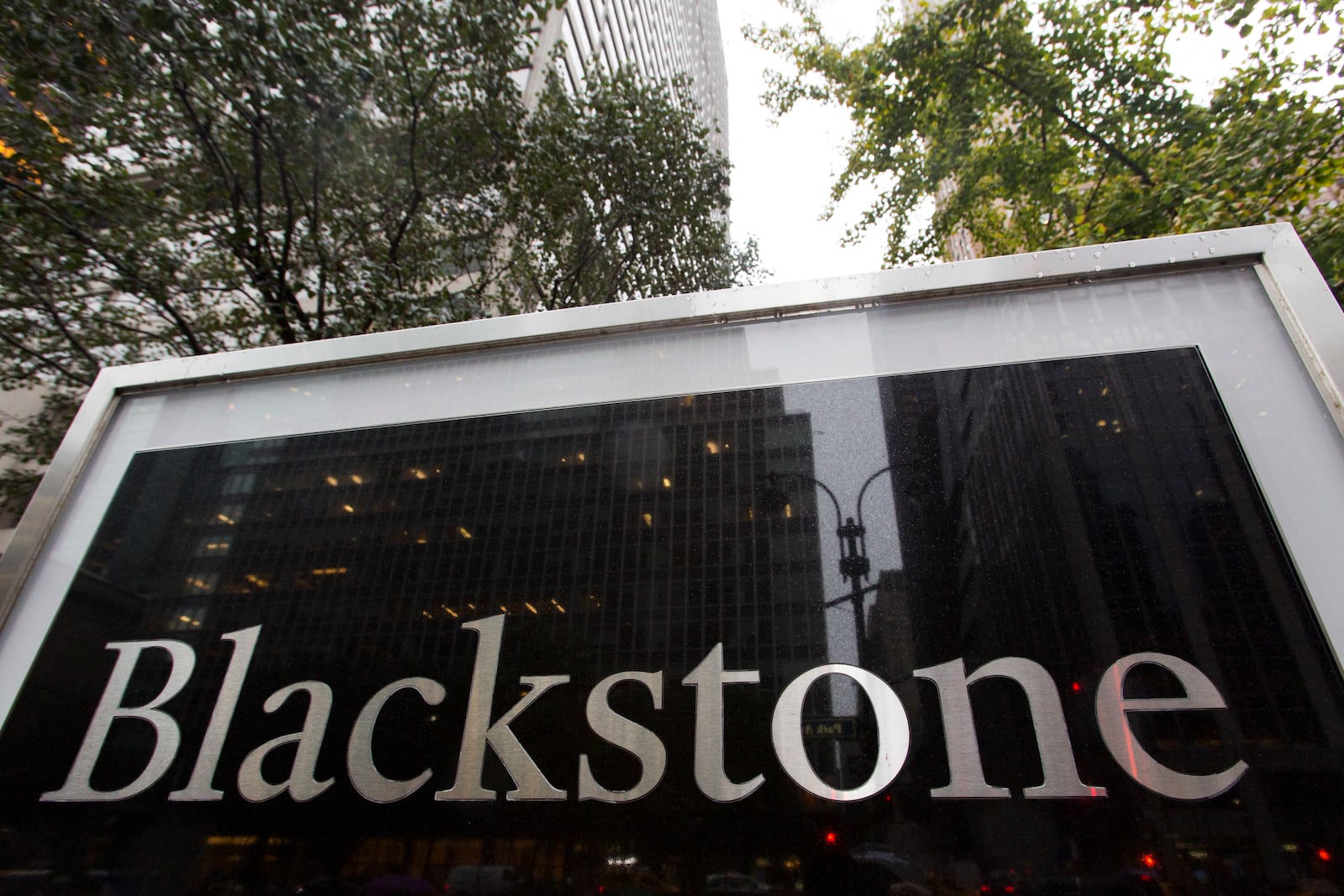 FILE - A sign for The Blackstone Group L.P. investment firm stands in front of their offices, Oct. 15, 2018, in New York. (AP Photo/Mark Lennihan, File)