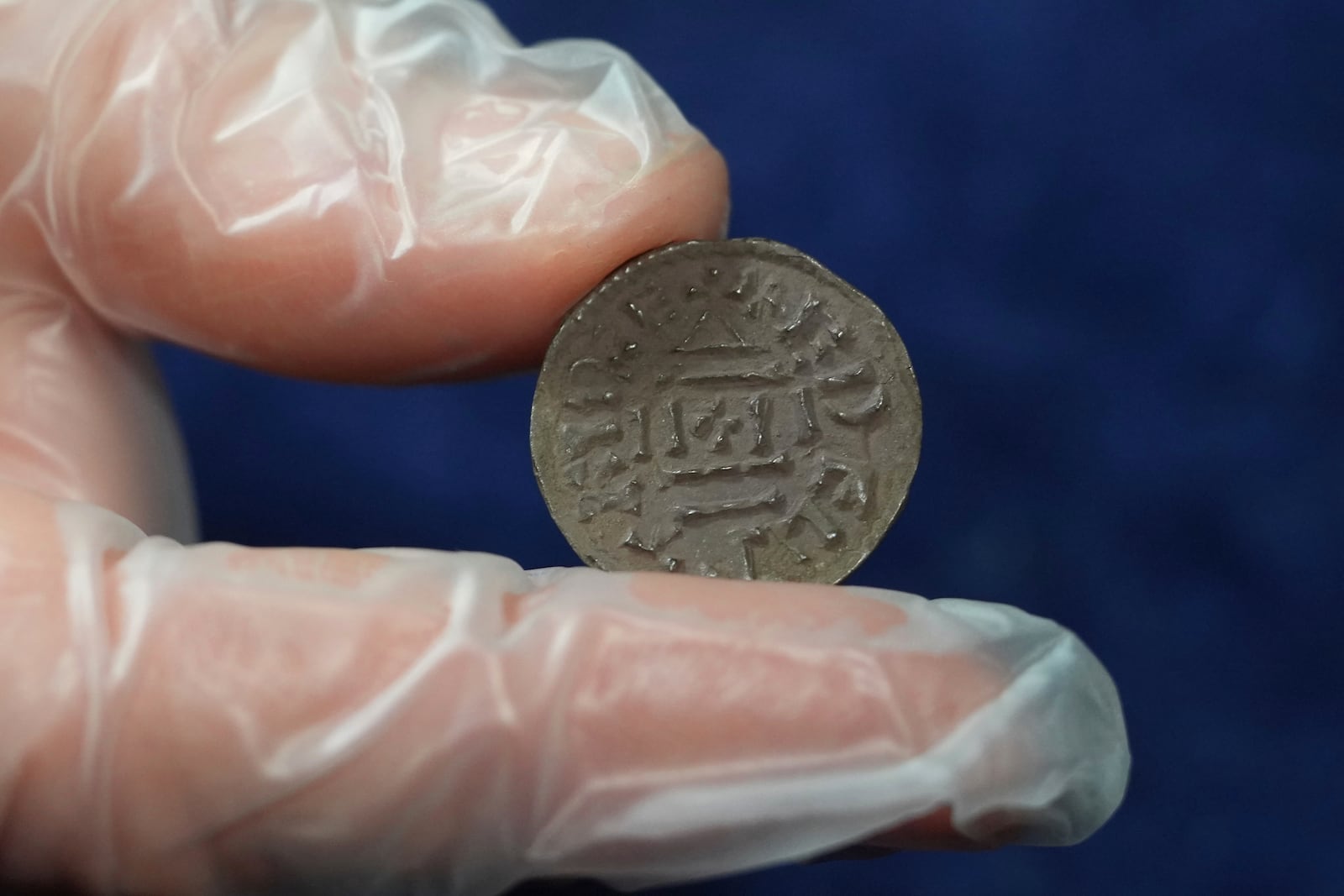 An early medieval silver penny of Guthrum of East Anglia, the first silver coin minted by a Viking ruler in Britain, is displayed at the British Museum's annual treasure launch in London, Tuesday, Feb. 11, 2025. (AP Photo/Kirsty Wigglesworth)