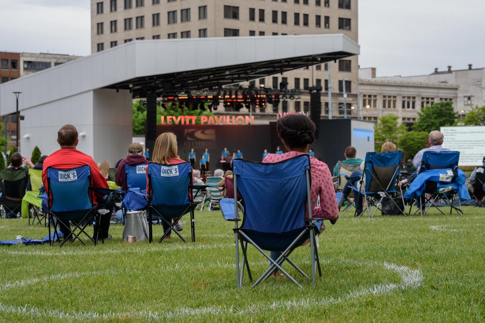 The Kettering Children’s Choir Spring Concert signaled the return of in-person concerts at Levitt Pavilion in downtown Dayton on Saturday, May 15, 2021. Levitt’s entire 2020 season of free concerts were cancelled due to the coronavirus pandemic. Circles have been spray painted on the lawn to designate socially distanced seating areas for guests who bring lawn chairs and/or blankets. TOM GILLIAM / CONTRIBUTING PHOTOGRAPHER