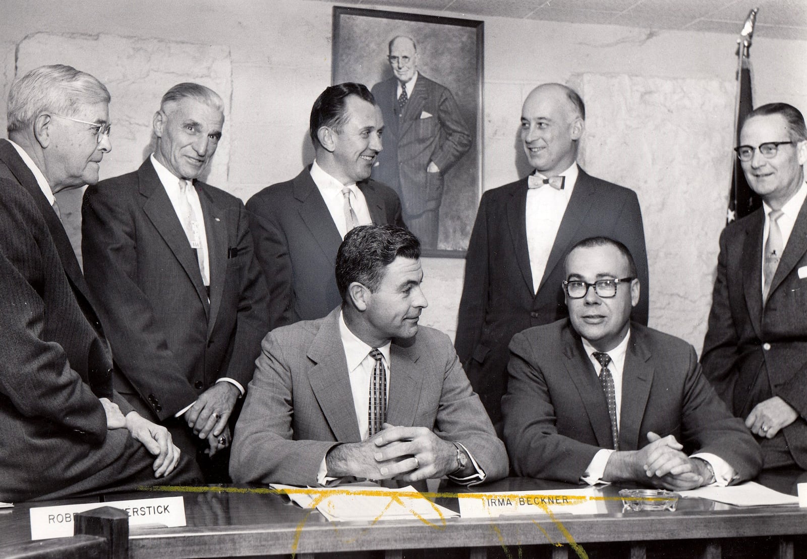 The 1957 caption on this newspaper photograph reads, " Three new members of Kettering's city council who'll take their seats formally at the end of the year joined holdover councilmen last night under the benevolent eyes of Charles F. Kettering, see portrait, who gave the city his name. At front (seated) are Vice Mayor Robert Haverstick and Mayor STan Cybvig. At rear (left to right) are Edward Dexter, William Kanter, James Hoefling, William F. Smith and Claude Cannon. Hoefling, Smith and Cannon are newcomers." DAYTON DALY NEWS ARCHIVE