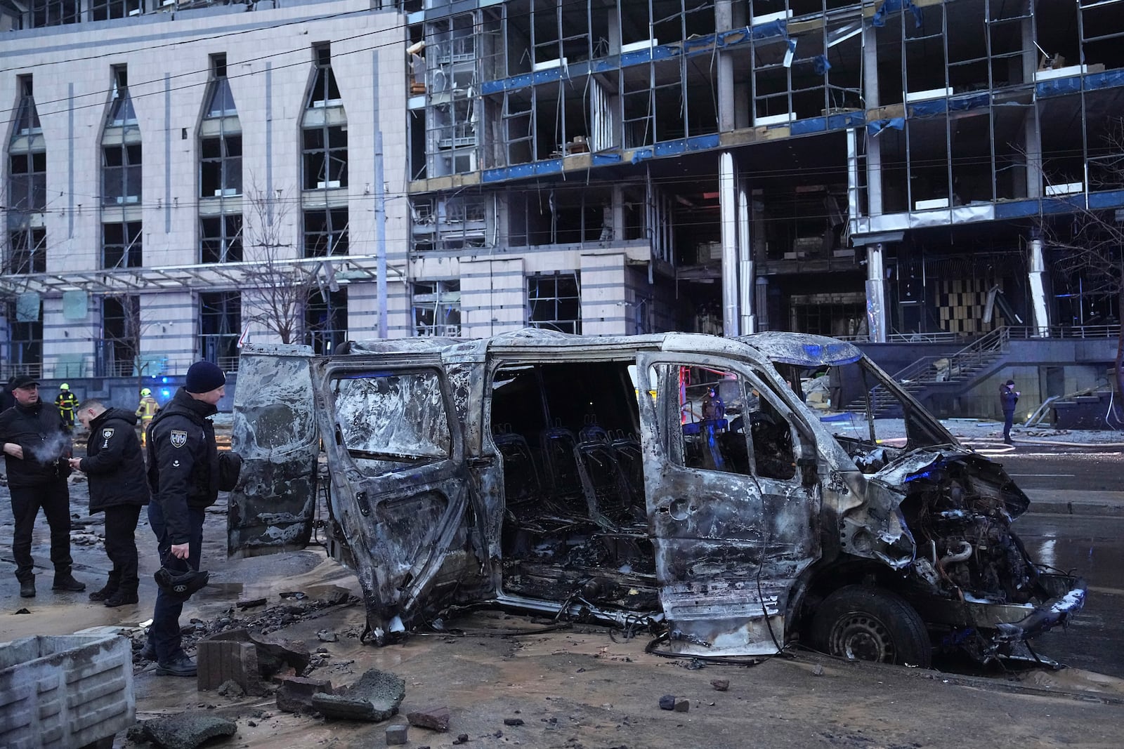 Police officers collect evidence following a Russian missile attack in Kyiv, Ukraine, Saturday, Jan. 18, 2025. (AP Photo/Efrem Lukatsky)