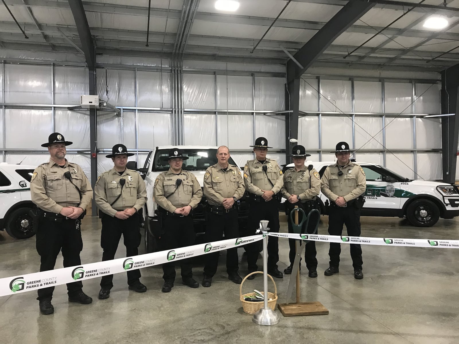 Brentwood Builders of Centerville, BlueScope Construction out of Kansas City, Greene Co. Parks & Trails director Jon Dobney, Greene. Co. Park Rangers and other project leaders cut the ribbon on the new home of the Greene Co. Parks & Trails building on Wednesday, December 18, 2019. STAFF PHOTO / SARAH FRANKS