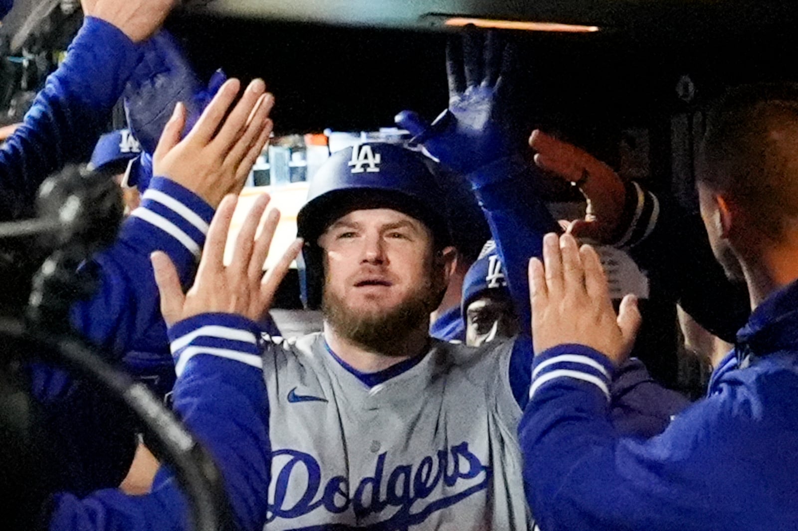 Los Angeles Dodgers' Max Muncy celebrates his home run against the New York Mets during the ninth inning in Game 3 of a baseball NL Championship Series, Wednesday, Oct. 16, 2024, in New York. (AP Photo/Ashley Landis)