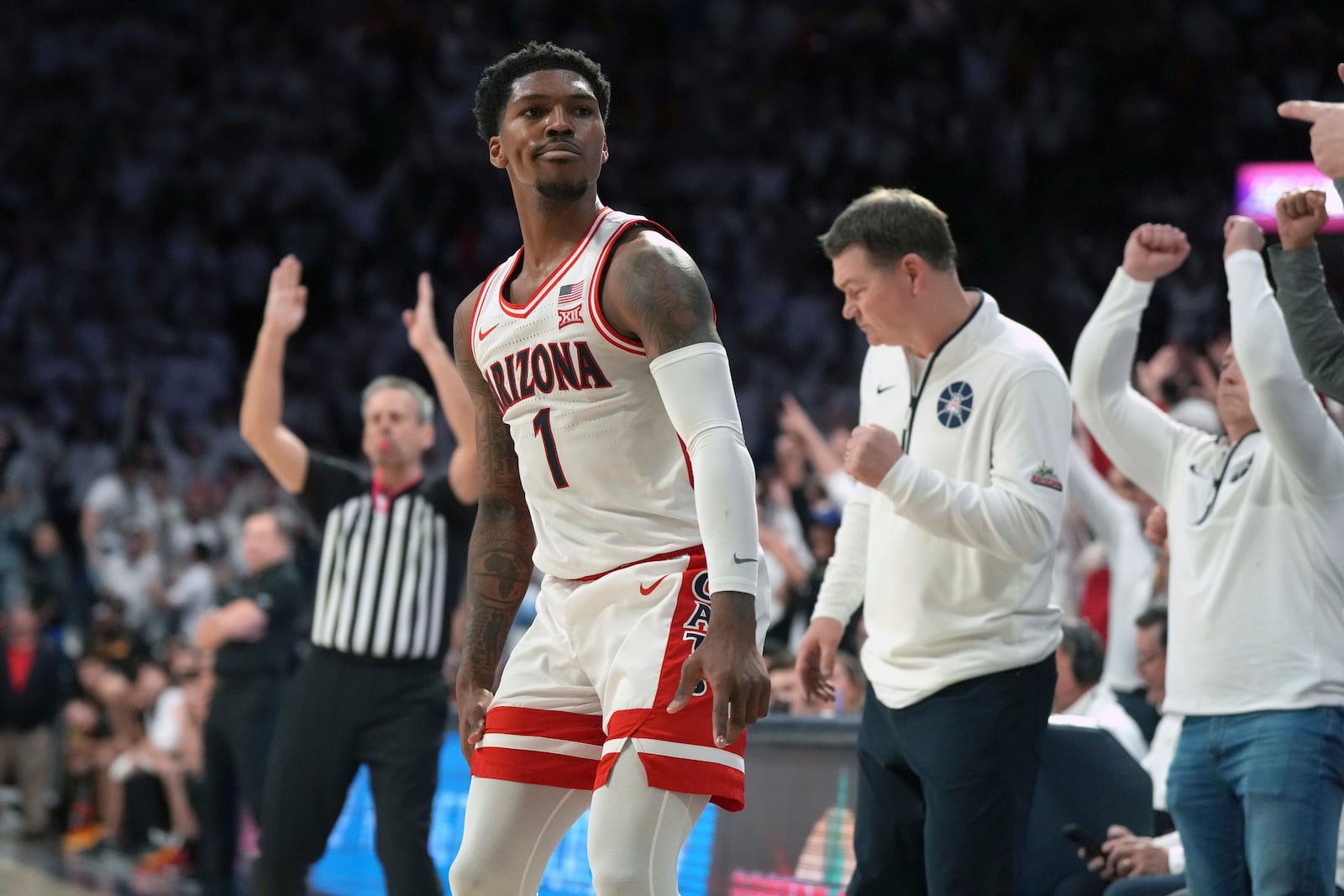 Arizona guard Caleb Love reacts after scoring against Iowa State during the second half of an NCAA college basketball game, Monday, Jan. 27, 2025, in Tucson, Ariz. (AP Photo/Rick Scuteri)