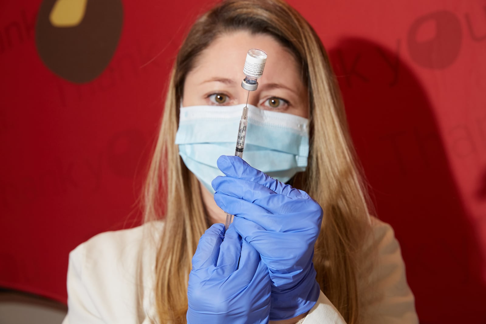 Julie Kennerly-Shah, a pharmacist at The Ohio State University Wexner Medical Center prepares a dose of the Pfizer-BioNTech COVID-19 vaccine in Columbus, Ohio, Tuesday, Dec. 15, 2020. (Brian Kaiser/The New York Times)