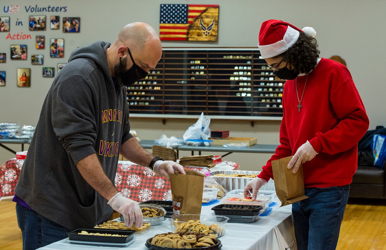 Volunteers fill bags with homemade and store-bought cookies Dec. 8 during the 21st annual Airmen Cookie Drive at Wright-Patterson Air Force Base. U.S. AIR FORCE PHOTO/JAIMA FOGG