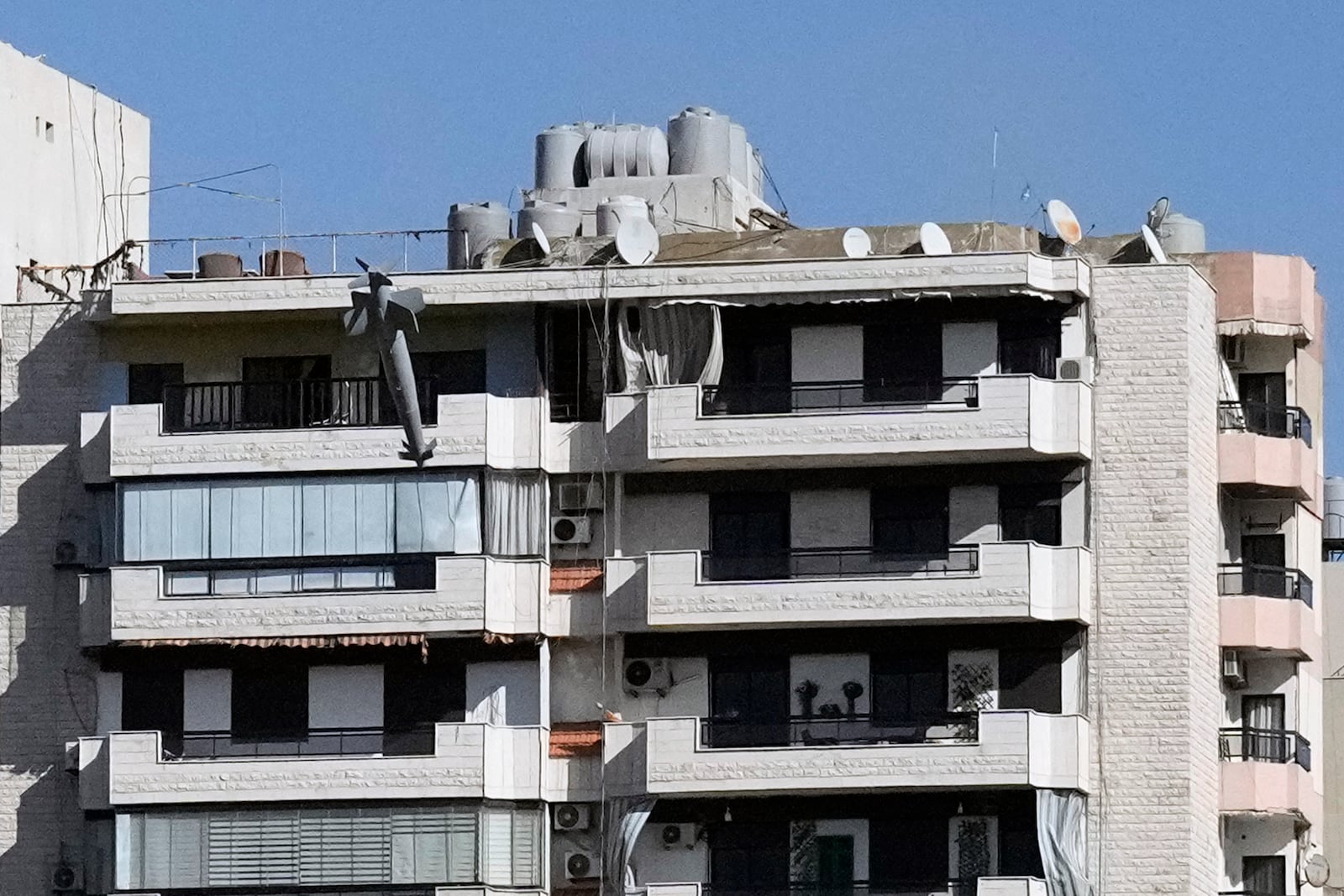 A missile launched from an Israeli jet hits a building in Ghobeiri, Beirut, Lebanon, Tuesday, Oct. 22, 2024. (AP Photo/Bilal Hussein)