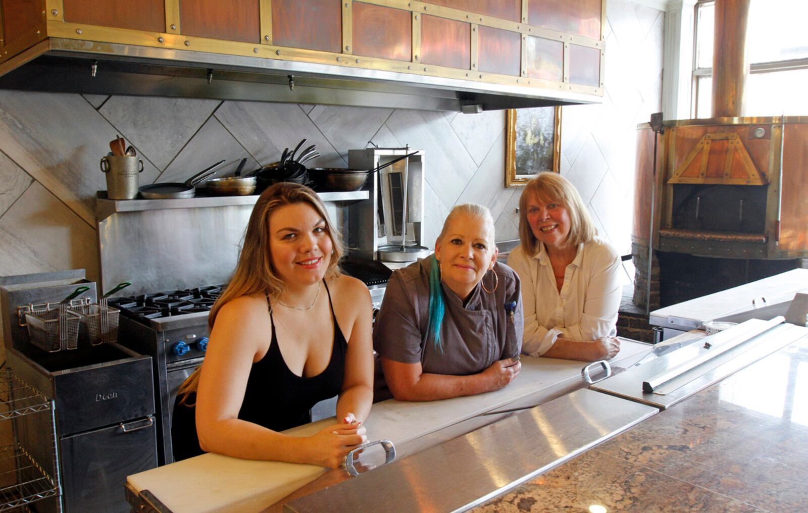 Cafe 1610 co-founders (l-r) Molly Blackshear, Xtine Brean and Cathy Mong in the new vegan restaurant scheduled to open to the public Saturday, Sept. 5.  SKIP PETERSON/CONTRIBUTED