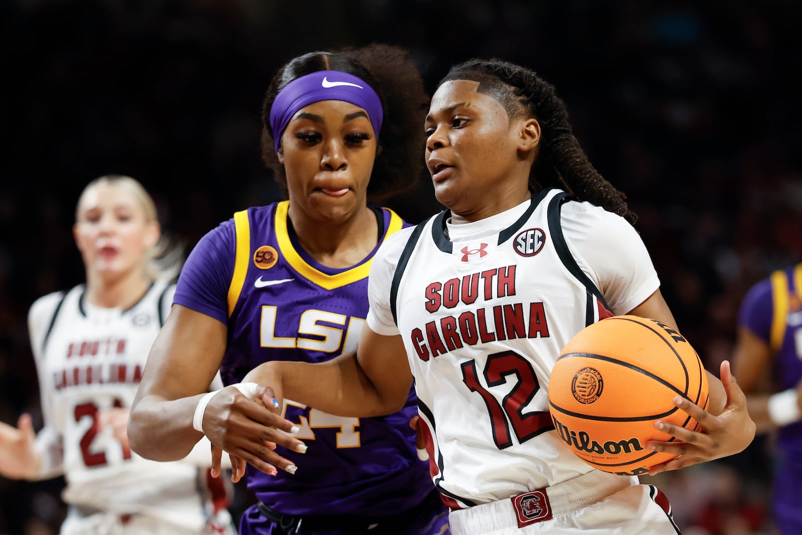 South Carolina guard MiLaysia Fulwiley (12) drives to the basket ahead of LSU guard Aneesah Morrow during the first half of an NCAA college basketball game in Columbia, S.C., Friday, Jan. 24, 2025. (AP Photo/Nell Redmond)