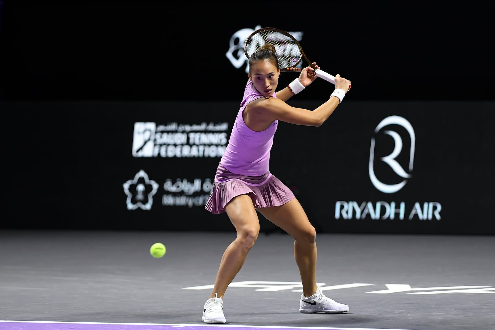 China's Qinwen Zheng shoots the ball during her women's singles semi final match against Czech Republic's Barbora Krejcikova at King Saud University Indoor Arena, in Riyadh, Saudi Arabia, Friday, Nov. 8, 2024. (AP Photo)