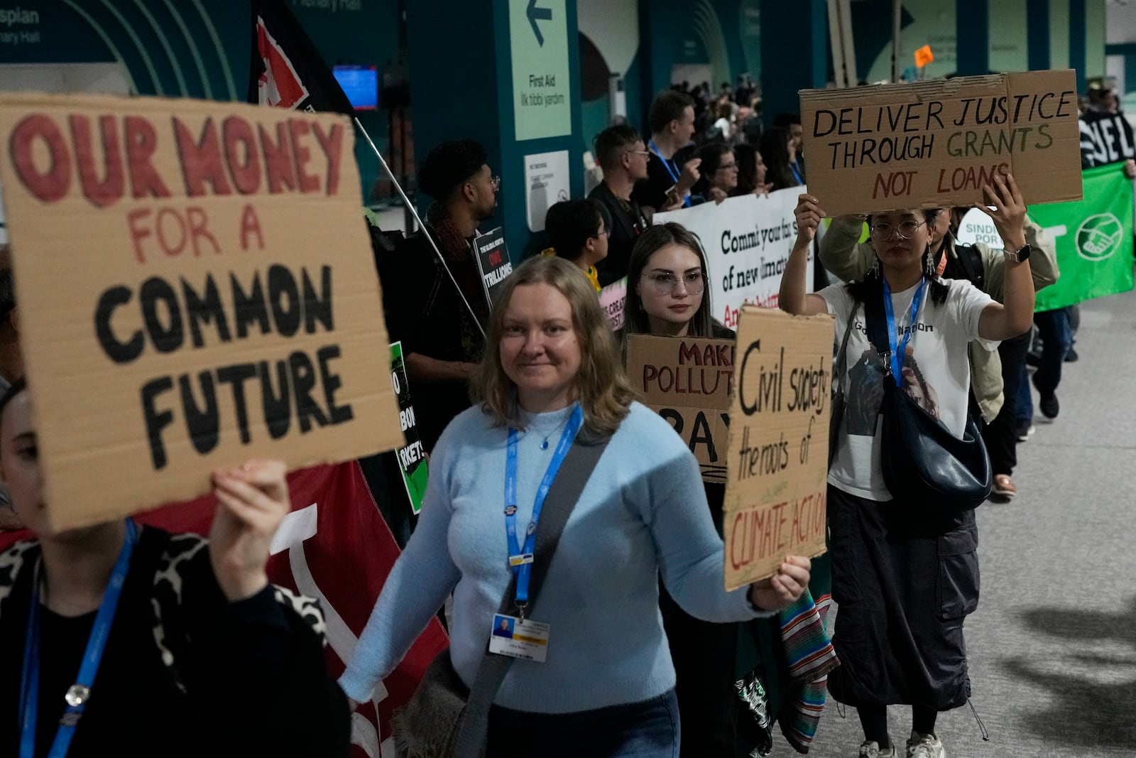 Activists participate in a demonstration for climate finance at the COP29 U.N. Climate Summit, Saturday, Nov. 16, 2024, in Baku, Azerbaijan. (AP Photo/Rafiq Maqbool)