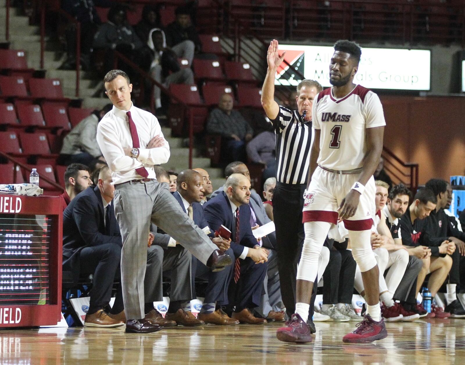 Massachusetts coach Matt McCall, left, and Jonathan Laurent react to a play during a game against Dayton Tuesday, Feb. 26, 2019, at the Mullins Center in Amherst, Mass.