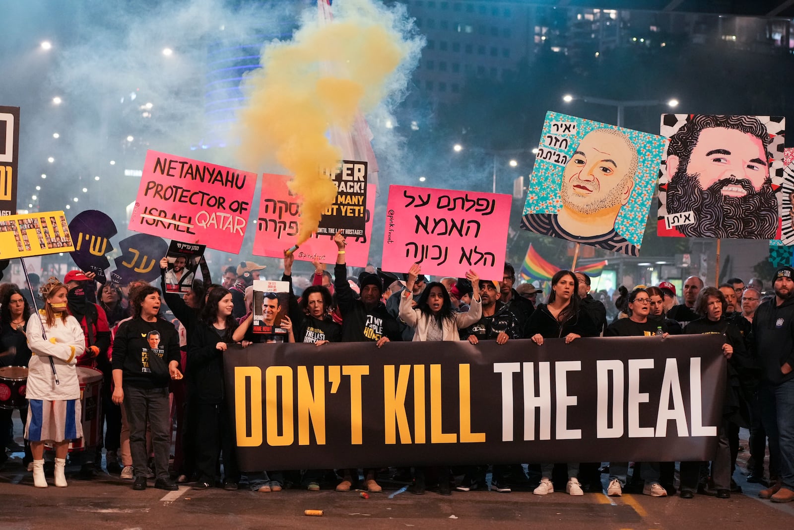 Protesters demanding the immediate release of hostages held by Hamas in the Gaza Strip, in Tel Aviv, Israel, Saturday, Feb. 15, 2025. (AP Photo/Ohad Zwigenberg)