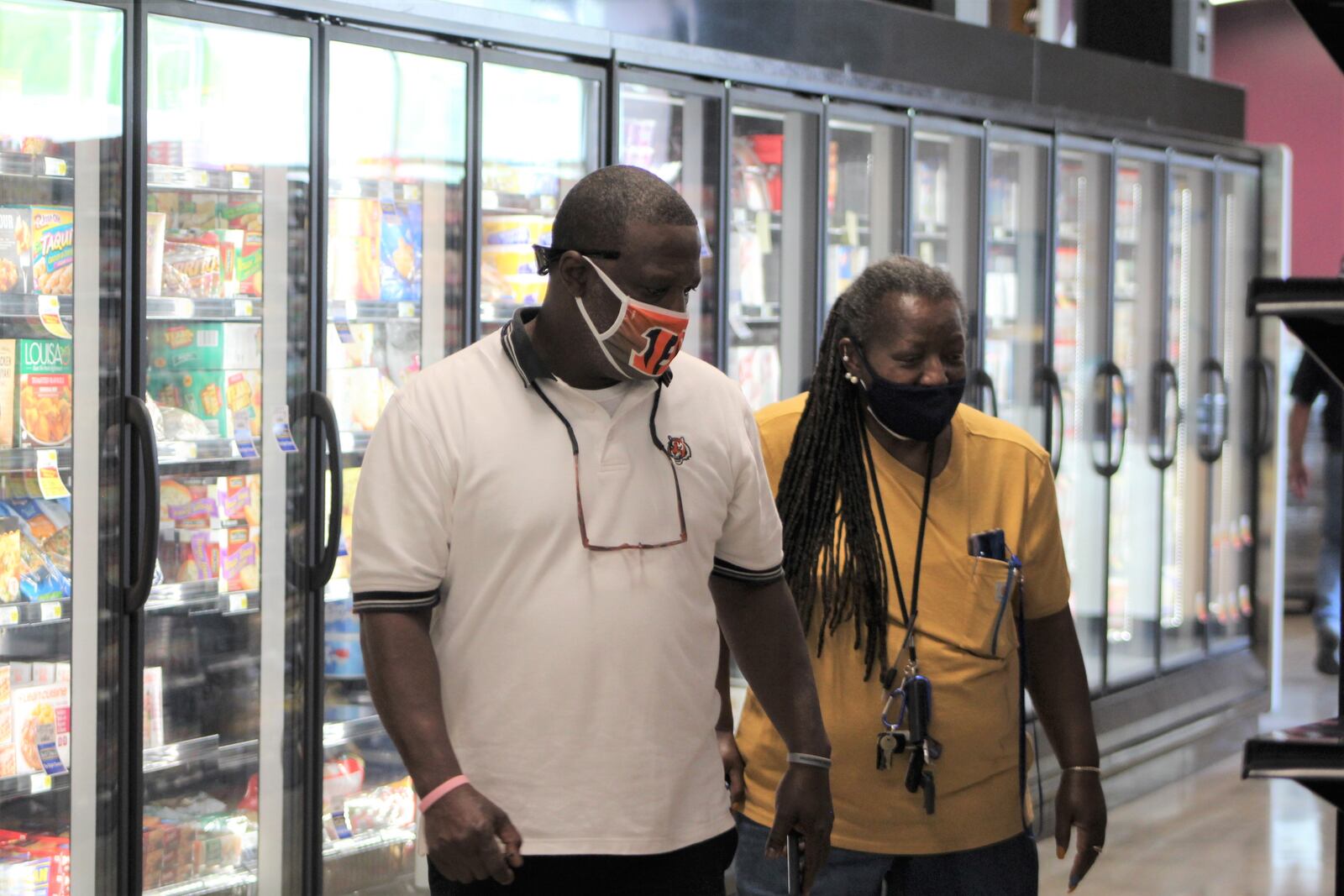 Community members tour the Gem City Market after the cooperative grocery store announced it will host a grand opening on May 12. CORNELIUS FROLIK / STAFF