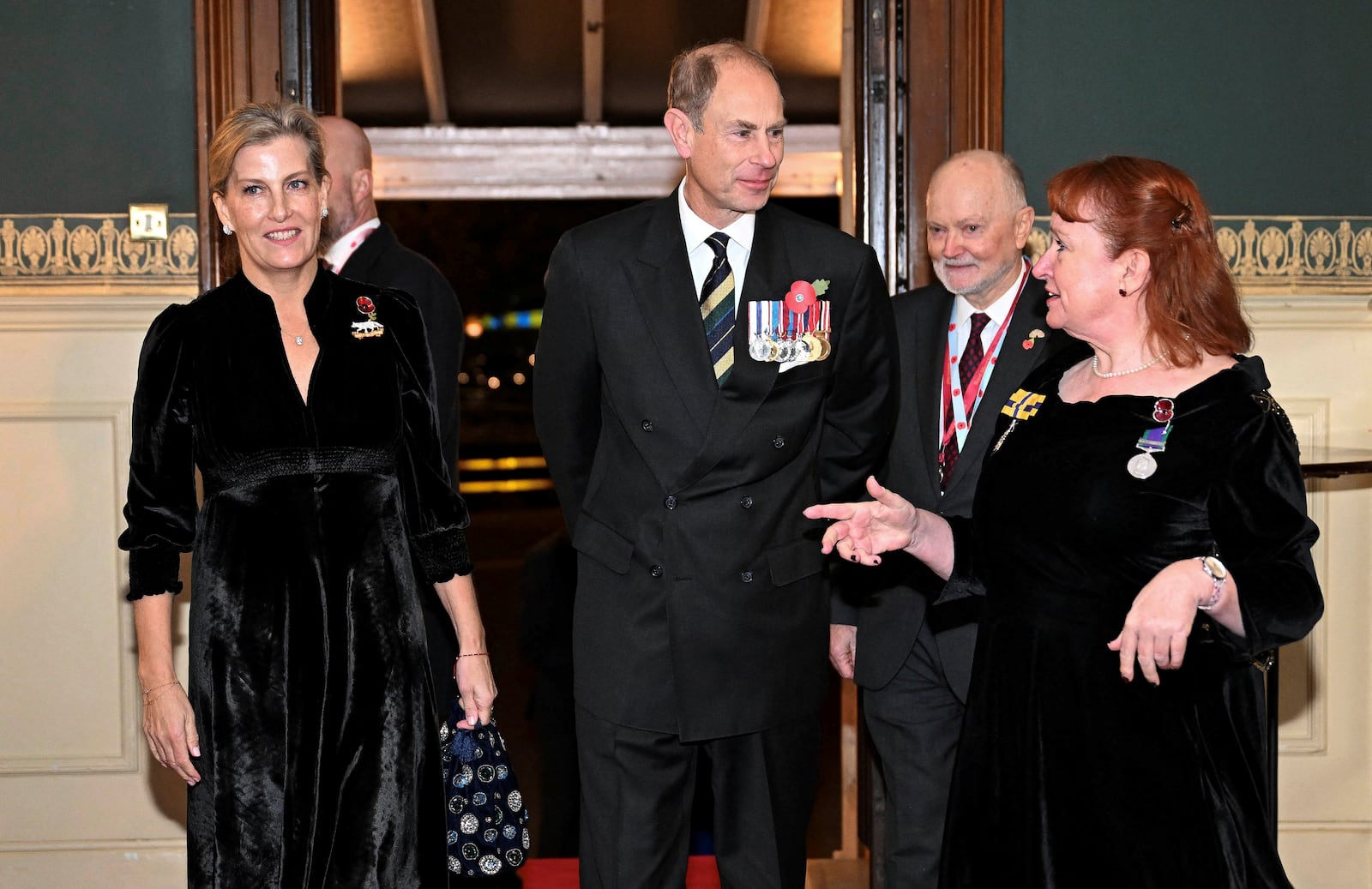 Prince Edward, Duke of Edinburgh, center, and Sophie, Duchess of Edinburgh, left, attend the Royal British Legion Festival of Remembrance at the Royal Albert Hall in London, Saturday Nov. 9, 2024. (Chris J. Ratcliffe/Pool Photo via AP)