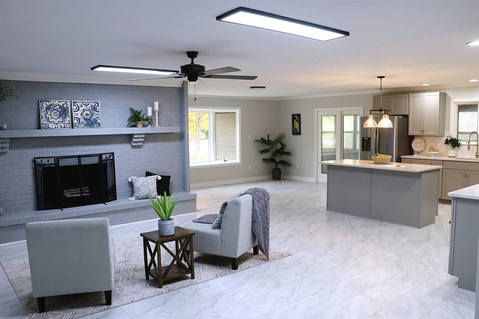 An open floor plan has three possible living space options: the kitchen, hearth room, and also an alcove area that would be perfect for a breakfast room. 