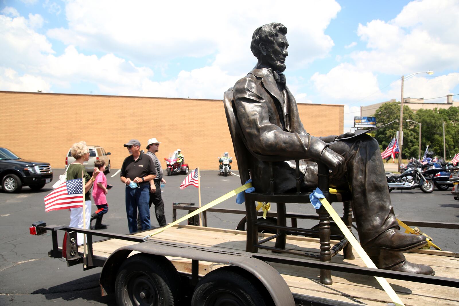 A 1,700-pound bronze sculpture of Abraham Lincoln created by Urbana artist Mike Major was delivered to Dayton Tuesday. The statue will be place in a park at the Dayton VA Medical Center campus in the fall. Majorâs work depicts a seated Lincoln, pen in hand, with legislation he has signed establishing the National Soldierâs and Sailorâs Asylum to care for Civil War veterans. Dayton was the location for one of the first three soldierâs homes in the country, which is now todayâs Dayton VA Medical Center. LISA POWELL / STAFF