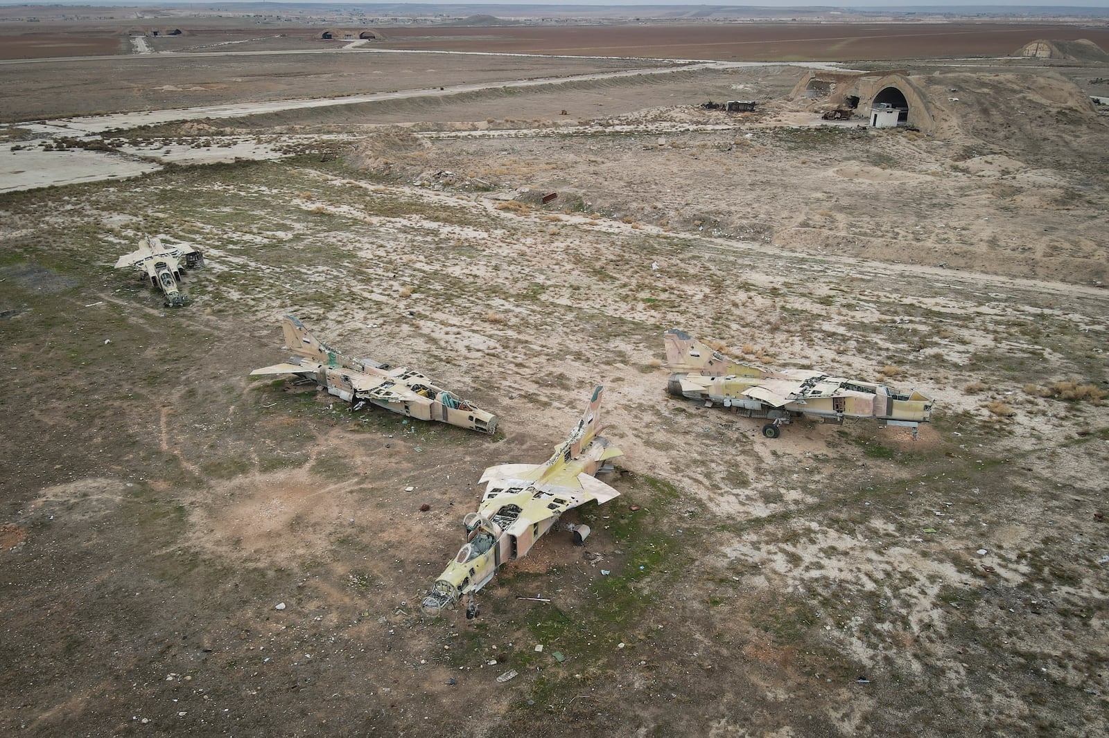 Decommissioned Syrian Air Force planes are seen at the Abu al-Duhur military airport, east of Idlib, following the takeover of the area by Syrian opposition fighters on Saturday, Dec. 7, 2024. (AP Photo/Omar Albam)