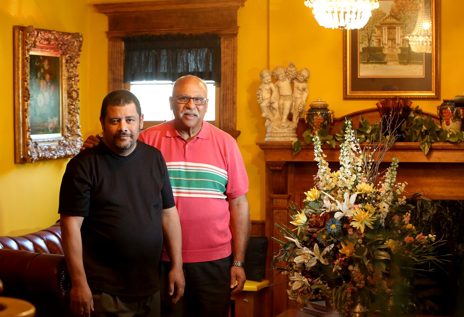 Fred Holley (right) with his son, Frederick Leon Holley.  LISA POWELL / STAFF