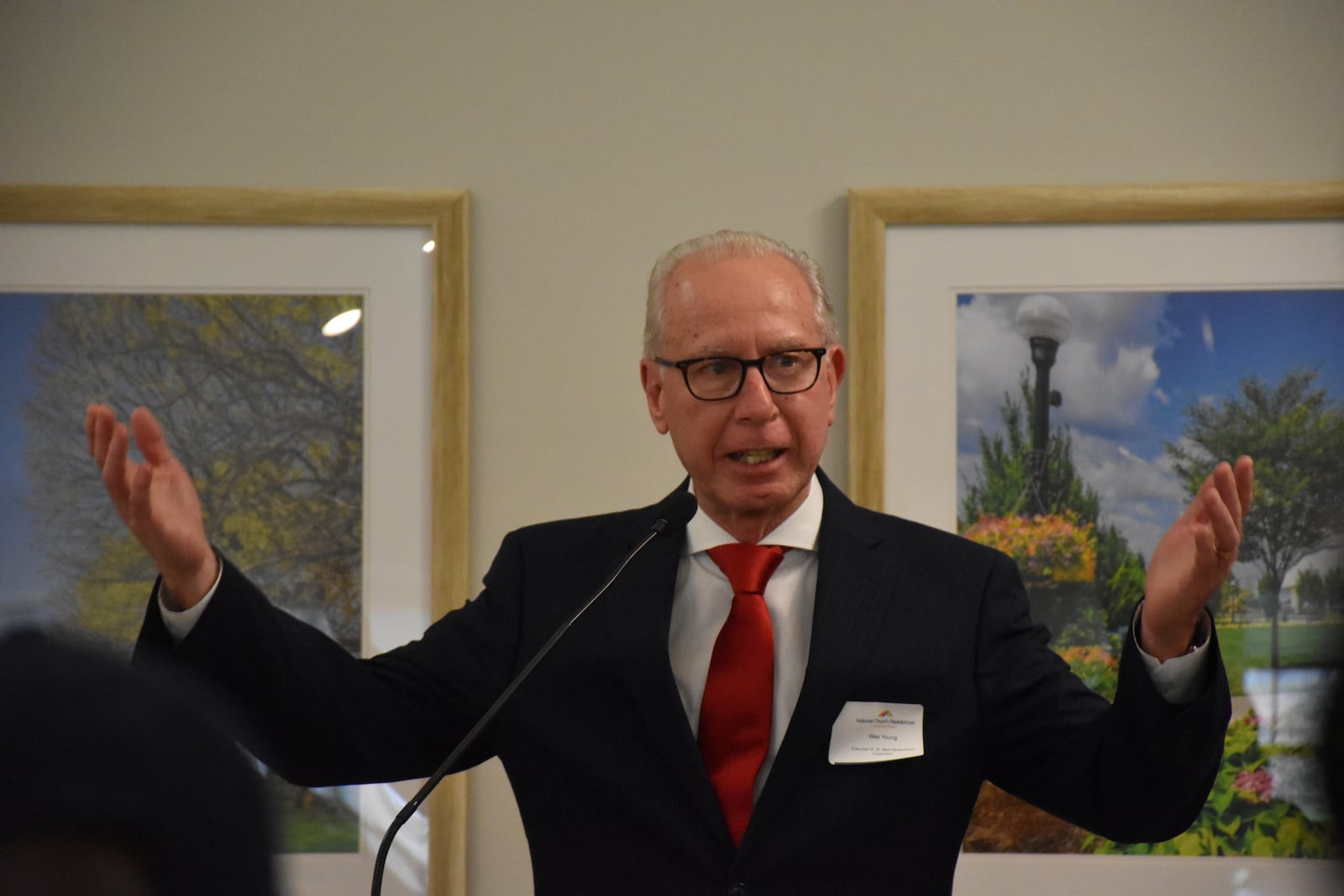 Wes Young, executive vice president of St. Mary Development Corp., speaks at the grand reopening of Hoover Place, a 144-unit senior housing complex in West Dayton. The housing underwent more than $9 million in renovations. CORNELIUS FROLIK / STAFF