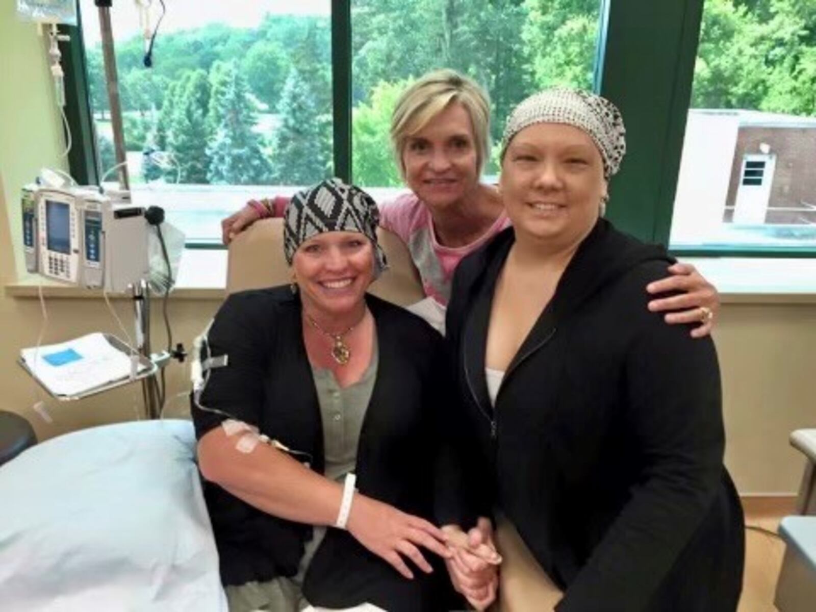 Susan and fellow breast cancer patient Maribeth (right) are seen during chemotherapy in 2016 at Kettering Cancer Center. Kelly (center) lent 
her support to her friends. Contributed
