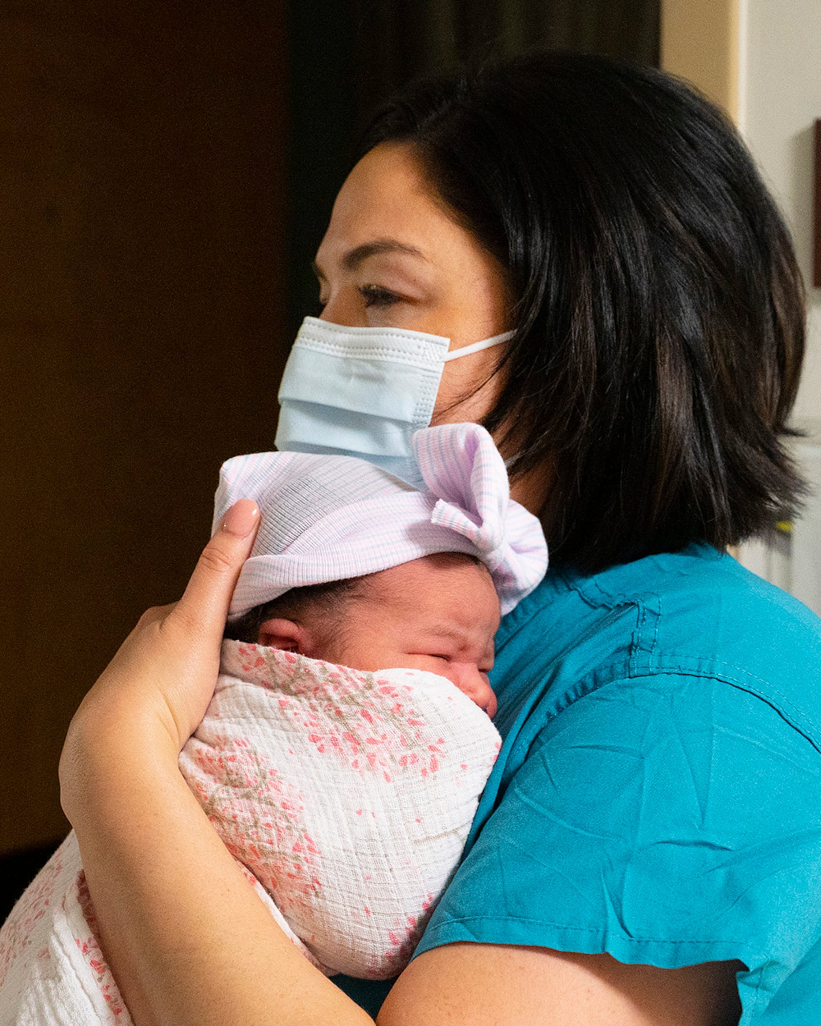 Capt. Dahlia Garcia, 88th Inpatient Operations Squadron charge nurse, holds 1-day-old Kalea Izzie Wallace on Jan. 5 during the night shift at Wright-Patterson Medical Center’s Labor and Delivery Ward. Kalea, the daughter of Patience Mantor and Army Spc. Cody Wallace, Ohio National Guard, was the first baby of the year born at the base hospital. U.S. AIR FORCE PHOTO/R.J. ORIEZ