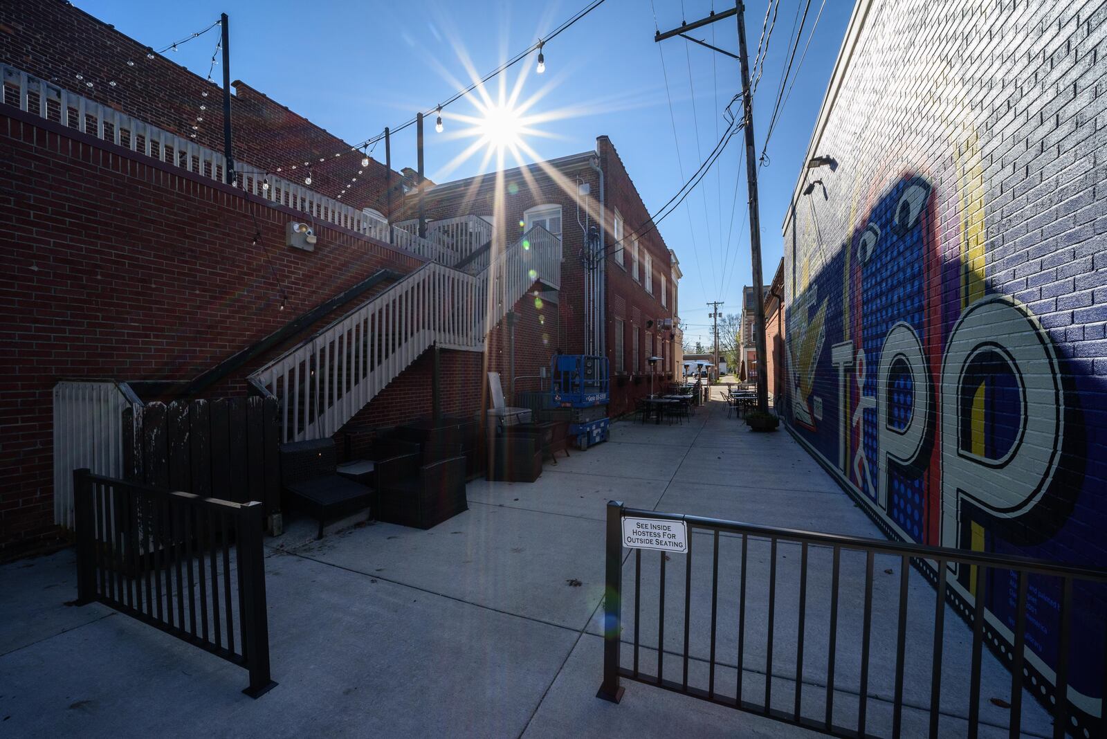 The new "See Yourself in Tipp" mural on the wall of the Tipp City Public Library facing the Coldwater Café at their shared alley outdoor patio space on October 31, 2020, shortly after its completion. TOM GILLIAM