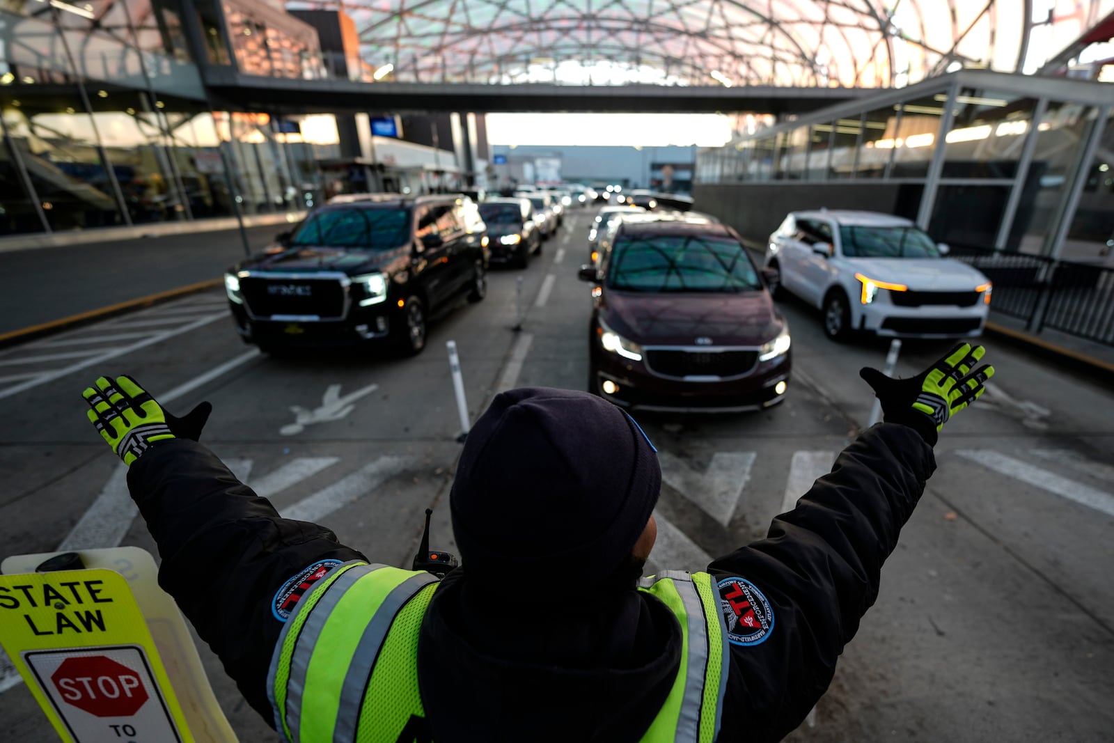 Traffic is stopped as people enter the Hartsfield-Jackson Atlanta International Airport, Friday, Dec. 20, 2024, in Atlanta. (AP Photo/Mike Stewart)