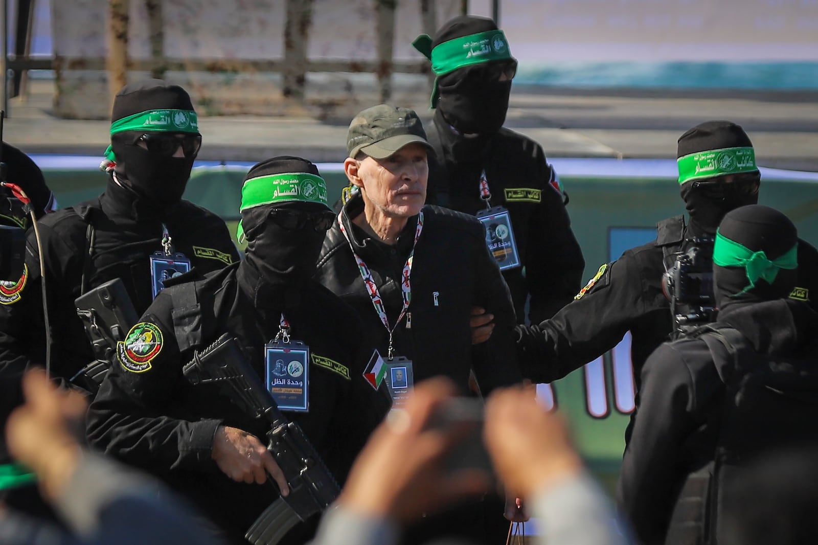 American-Israeli hostage Keith Siegel, 65, is escorted by Hamas fighters as he is handed over to the Red Cross in Gaza City, Saturday Feb.1, 2025.(AP Photo/Mohammed Hajjar)