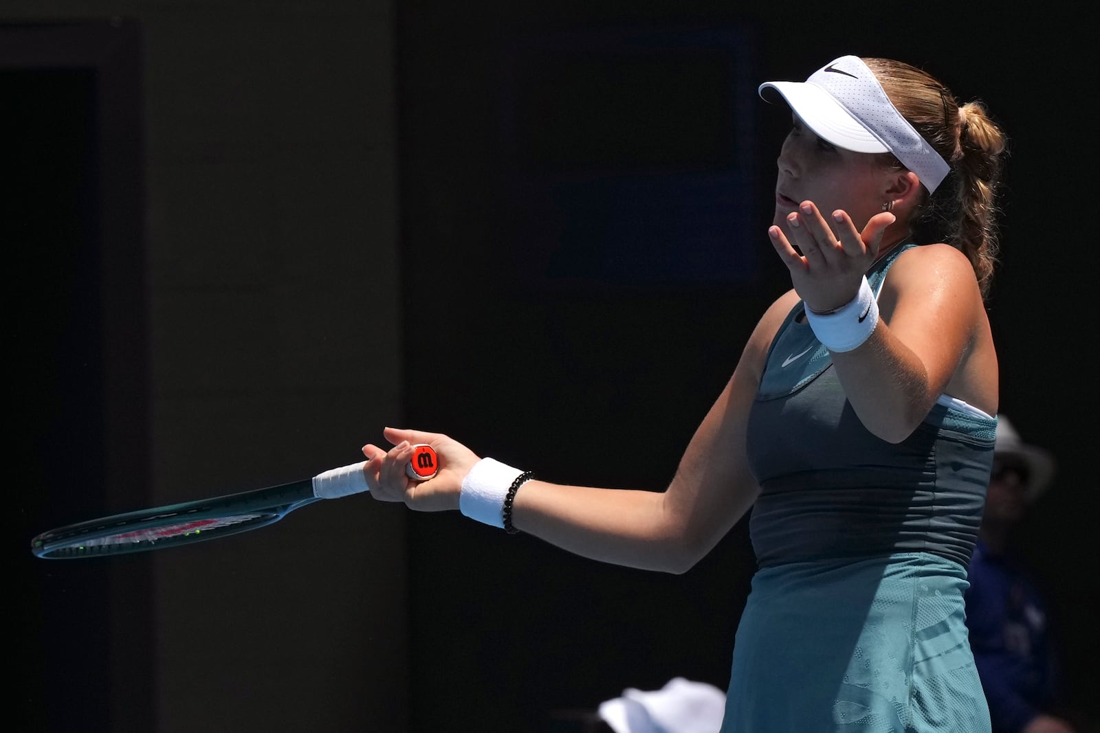 Mirra Andreeva of Russia reacts during her fourth round match against Aryna Sabalenka of Belarus at the Australian Open tennis championship in Melbourne, Australia, Sunday, Jan. 19, 2025. (AP Photo/Mark Baker)