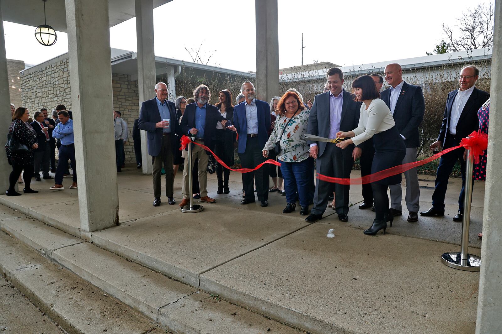 Jessimi Jones, executive director of the Springfield Museum of Art, cuts the ribbon outside the museum Thursday, March 23, 2023 during a ceremony marking the start of a multi-million dollar renovation of the museum's North Wing. BILL LACKEY/STAFF