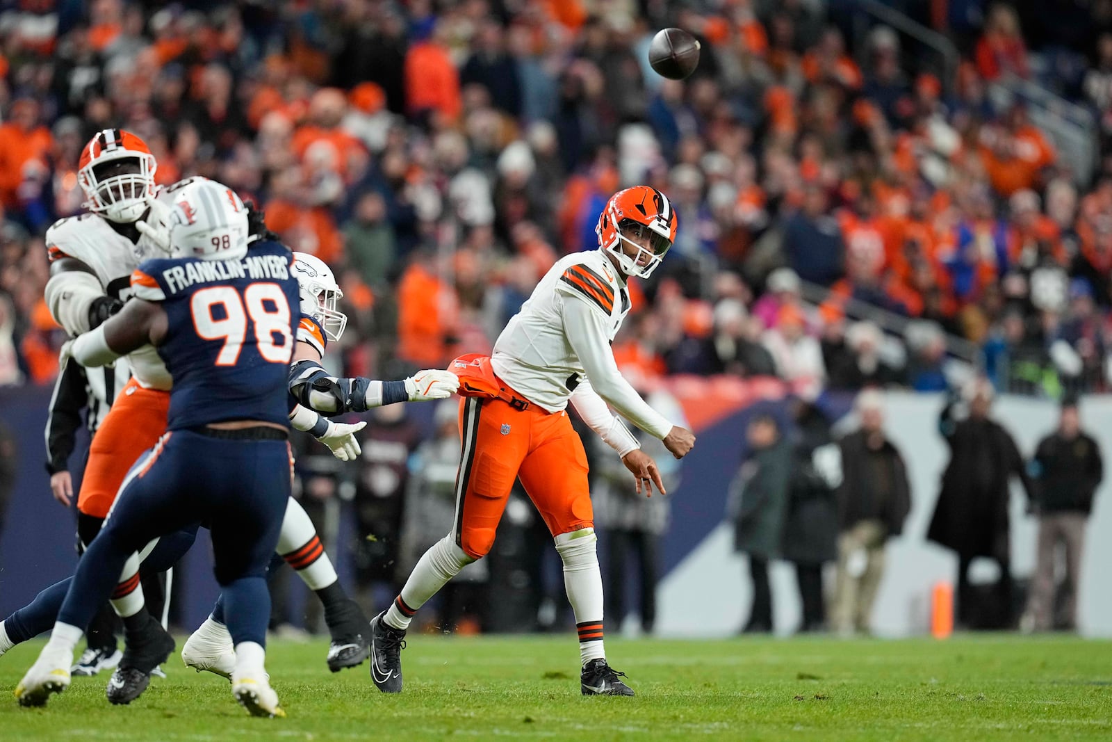 Cleveland Browns quarterback Jameis Winston throws an interceptionduring the first half of an NFL football game against the Denver Broncos, Monday, Dec. 2, 2024, in Denver. (AP Photo/Jack Dempsey)