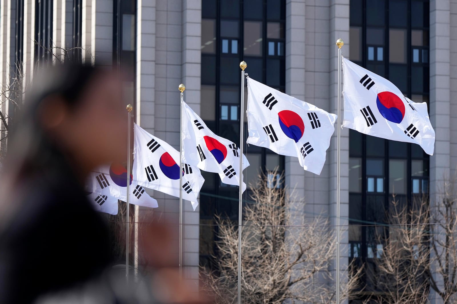 South Korean national flags flutter in the wind at the government complex in Seoul, South Korea, Thursday, Feb. 27, 2025. (AP Photo/Lee Jin-man)