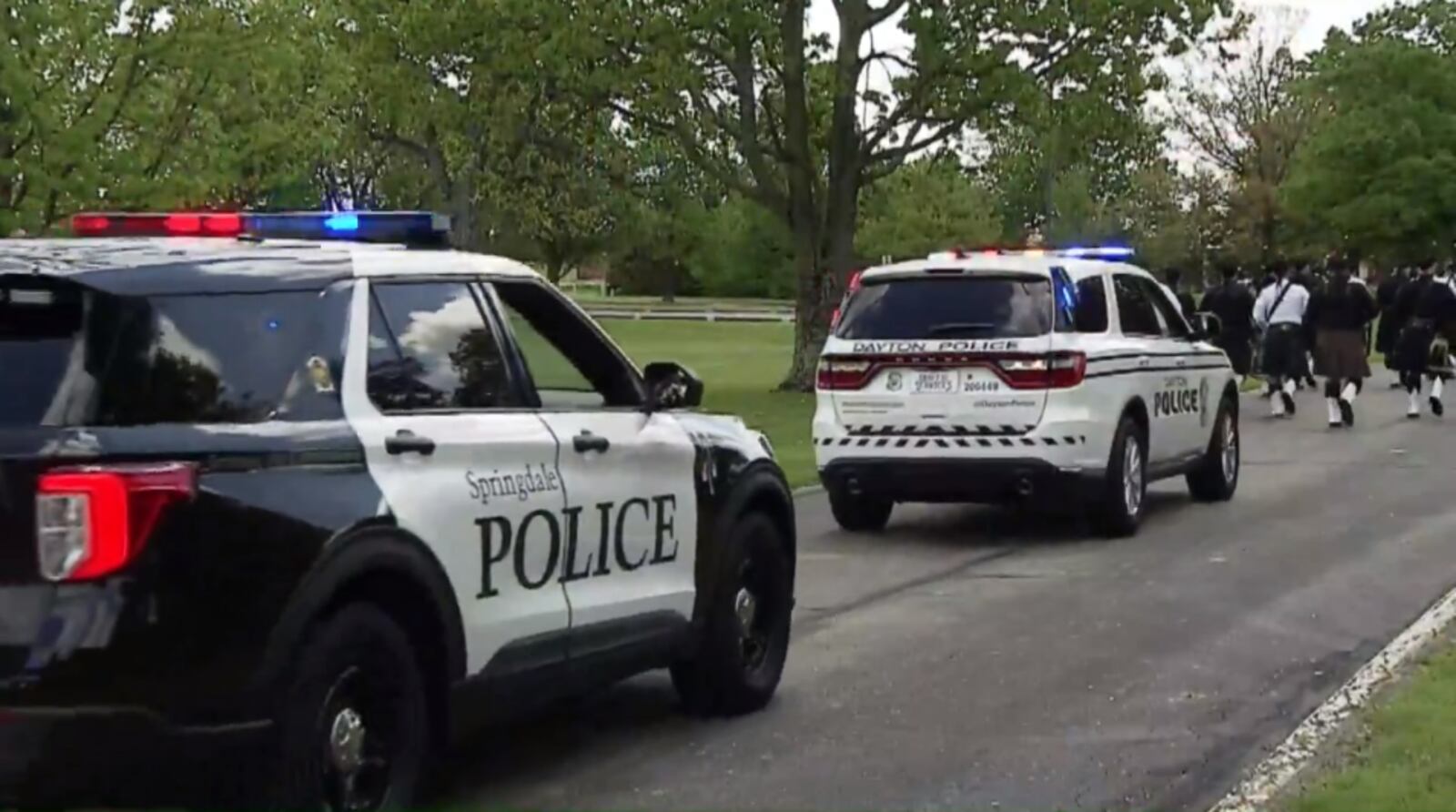 A Dayton Police Department cruiser follows a procession of bagpipers at the Ohio Peace Offices' Memorial on May 6, 2021. Dayton Detective Jorge DelRio was among law enforcement officers honored during the ceremony. He was shot and killed in the line of duty in November 2019.