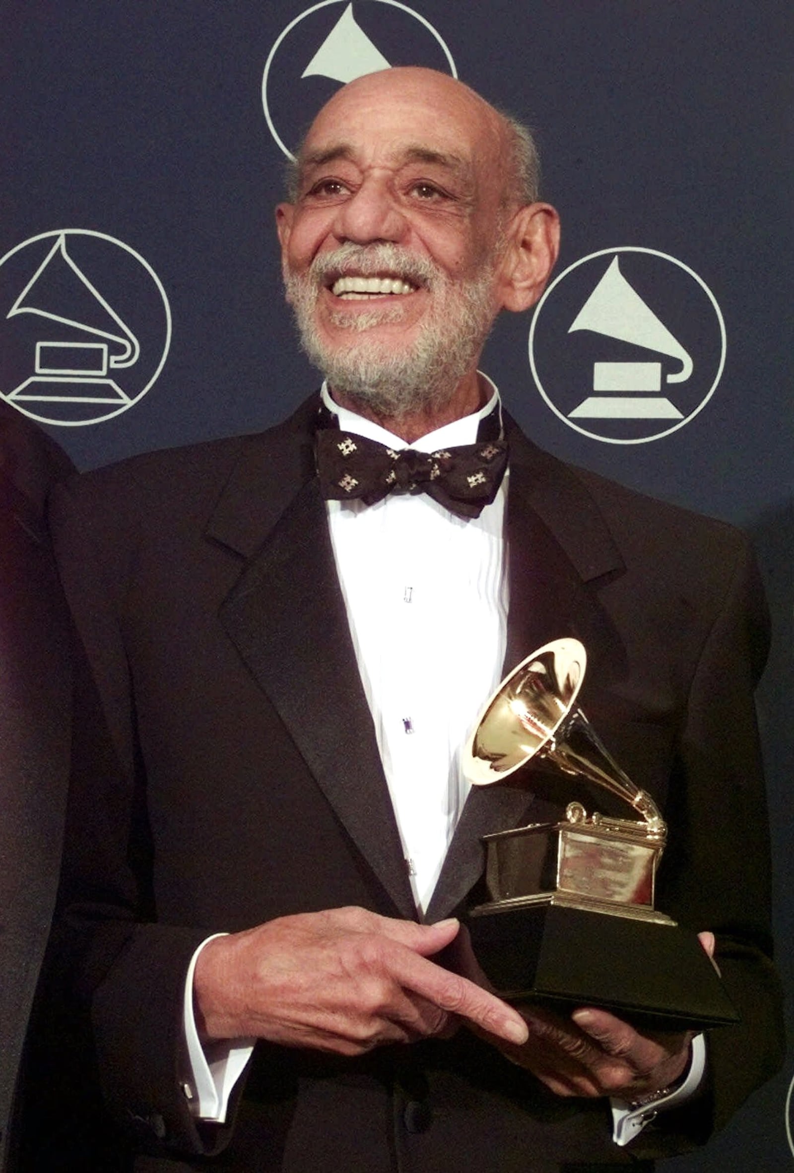 Donald Mills holds the Grammy for Lifetime Achievement at the 40th Annual Grammy Awards in this Feb. 25, 1998 file photo in New York.  Donald Mills, the last surviving member of the Mills Brothers singers, who broke racial barriers in radio, society an