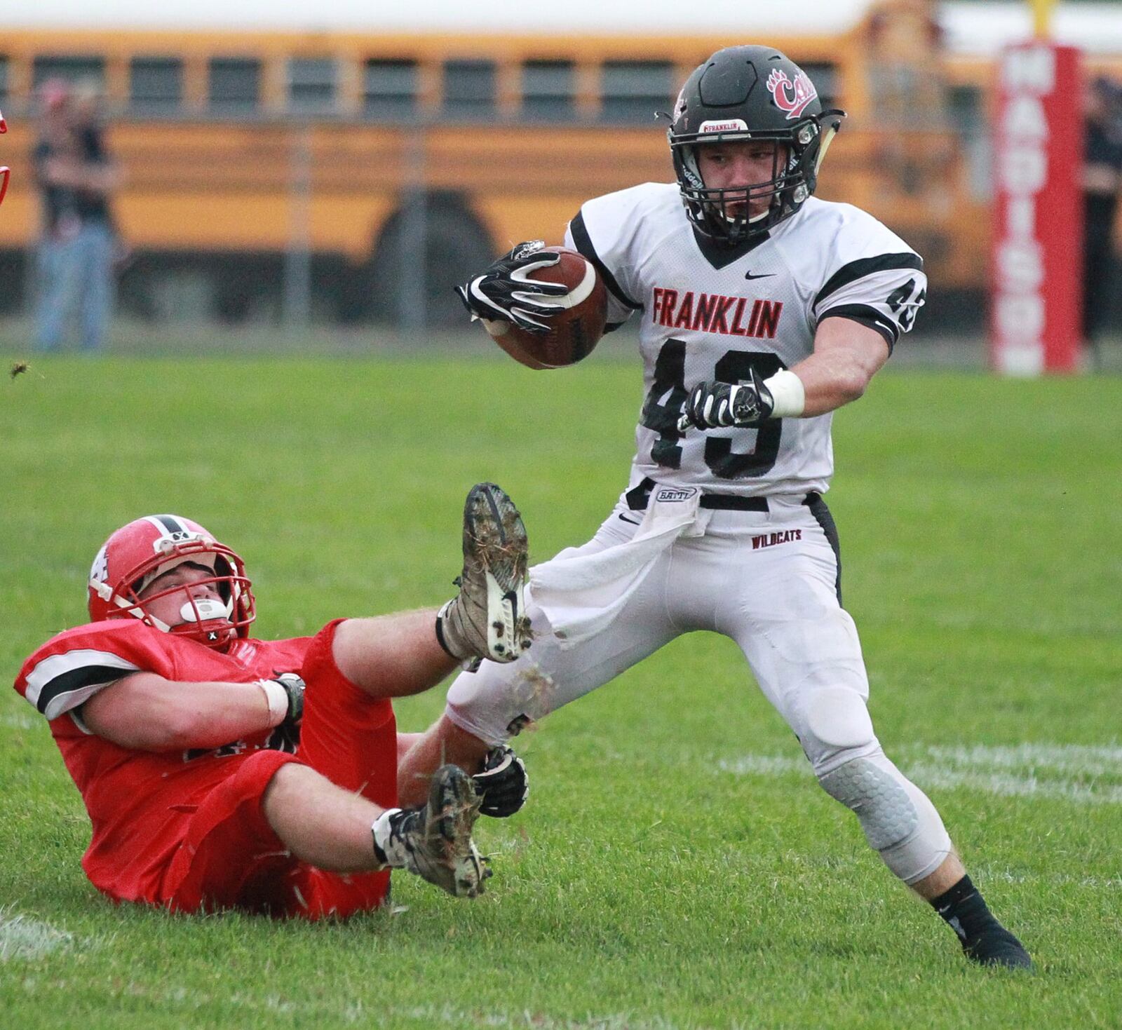 Gage Johnson of Franklin (with ball) eludes Gavin Turner of Madison. Franklin defeated host Madison 42-6 in a Week 1 high school football opener on Friday, Aug. 30, 2019. MARC PENDLETON / STAFF