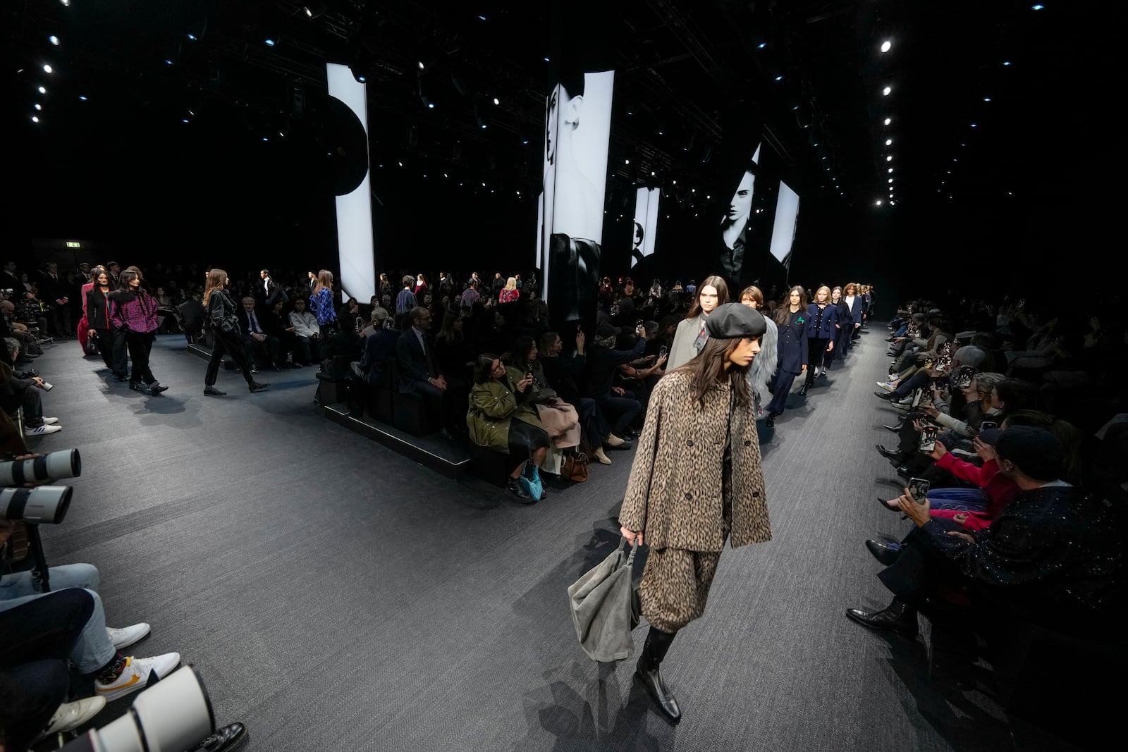 Models wear creations as part of the Emporio Armani Fall/Winter 2025-2026 Womenswear collection presented in Milan, Italy, Thursday, Feb. 27, 2025. (AP Photo/Luca Bruno)