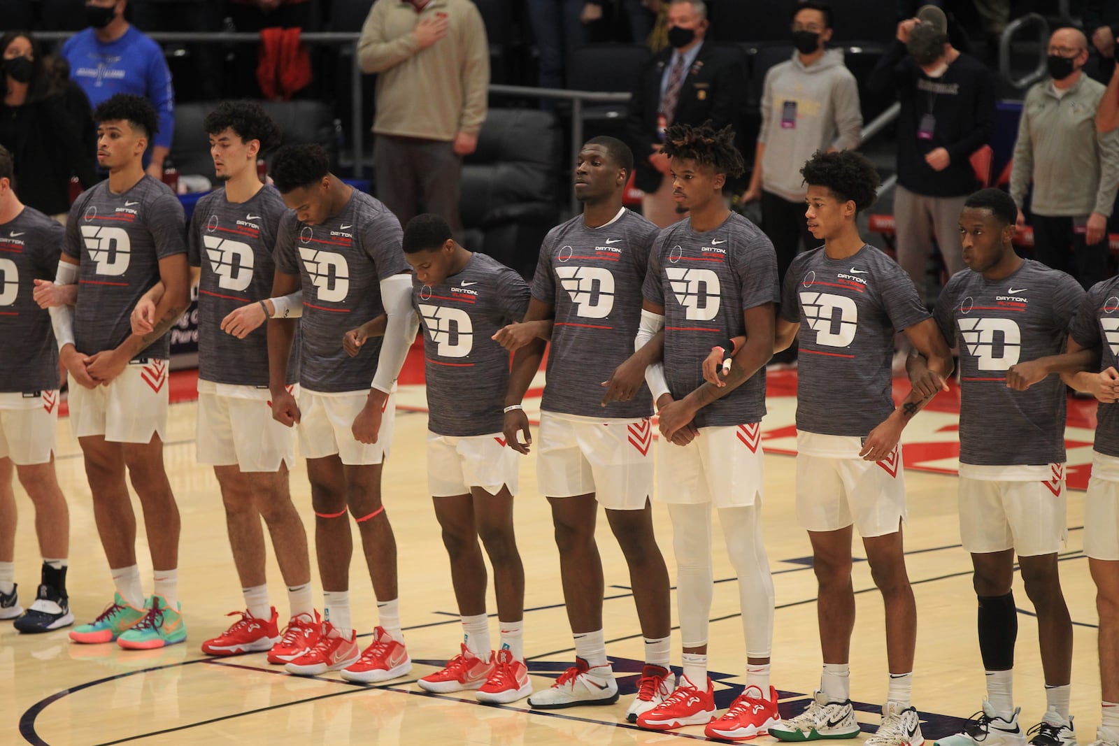 Dayton players stand for the national anthem before a game against Cedarville in an exhibition game on Monday, Nov. 1, 2021, at UD Arena. David Jablonski/Staff