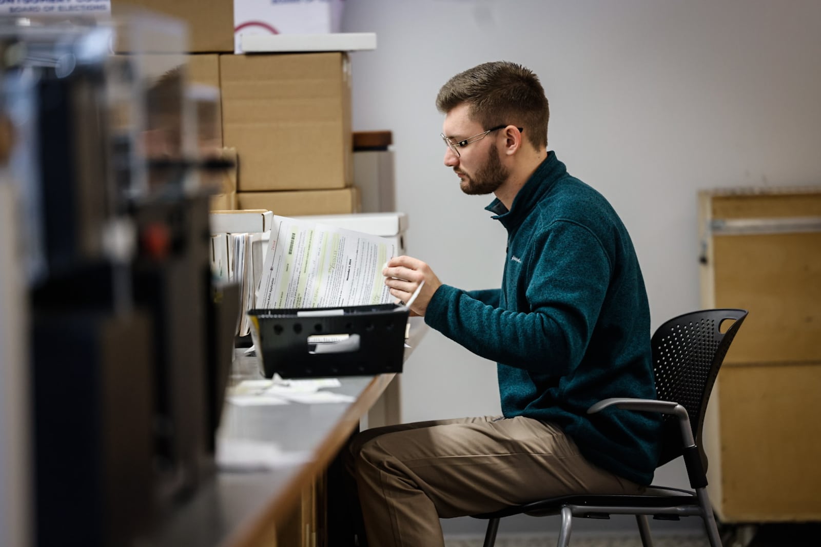 Montgomery County Board of Election worker Chase Aivalotis checks voter registrations Friday September 13, 2024. JIM NOELKER/STAFF