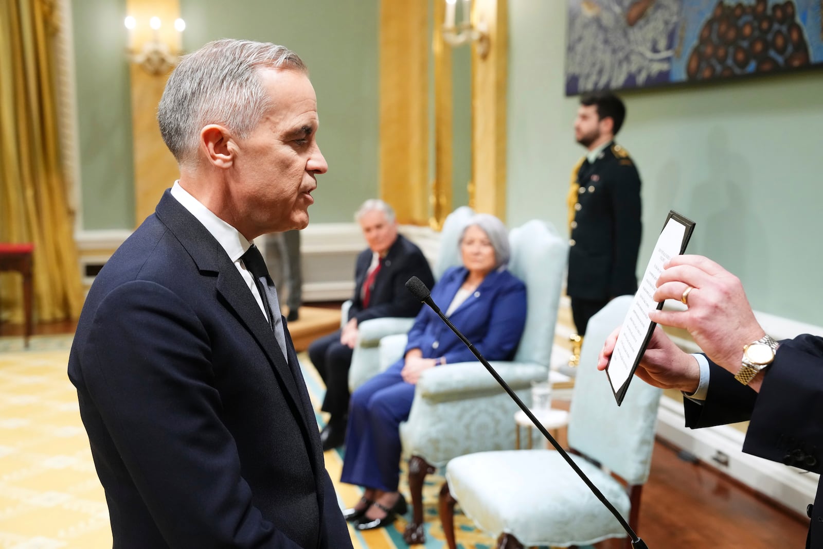 Mark Carney is sworn in as prime minister during a ceremony at Rideau Hall in Ottawa on Friday, March 14, 2025. (Sean Kilpatrick/The Canadian Press via AP)