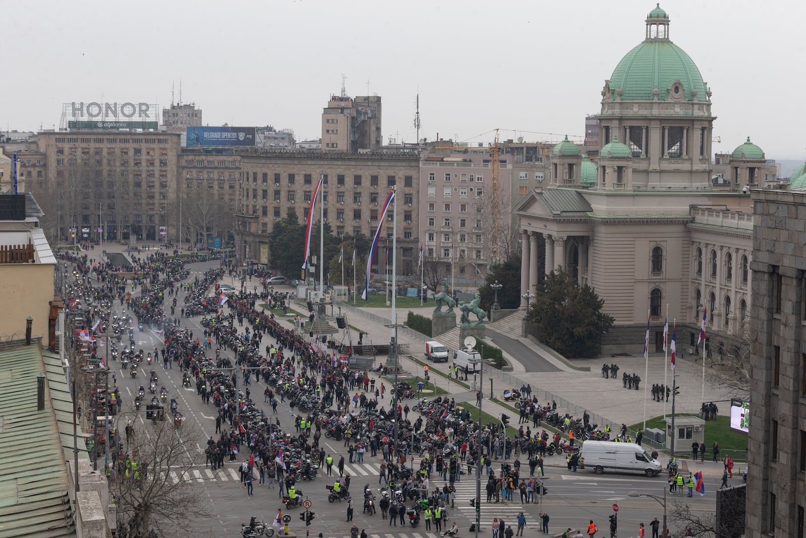 Hundreds of bikers gather in front of the Serbian parliament during a major anti-corruption rally led by university students in Belgrade, Serbia, Saturday, March 15, 2025. (AP Photo/Marko Drobnjakovic)