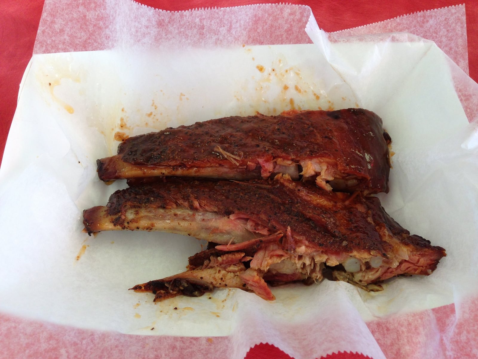 Pork spare ribs at Smokin Bar-B-Que are slow smoked for 7 hours. It’s impossible to pick up because the bone slides right off the meat. (Staff photo by Connie Post)