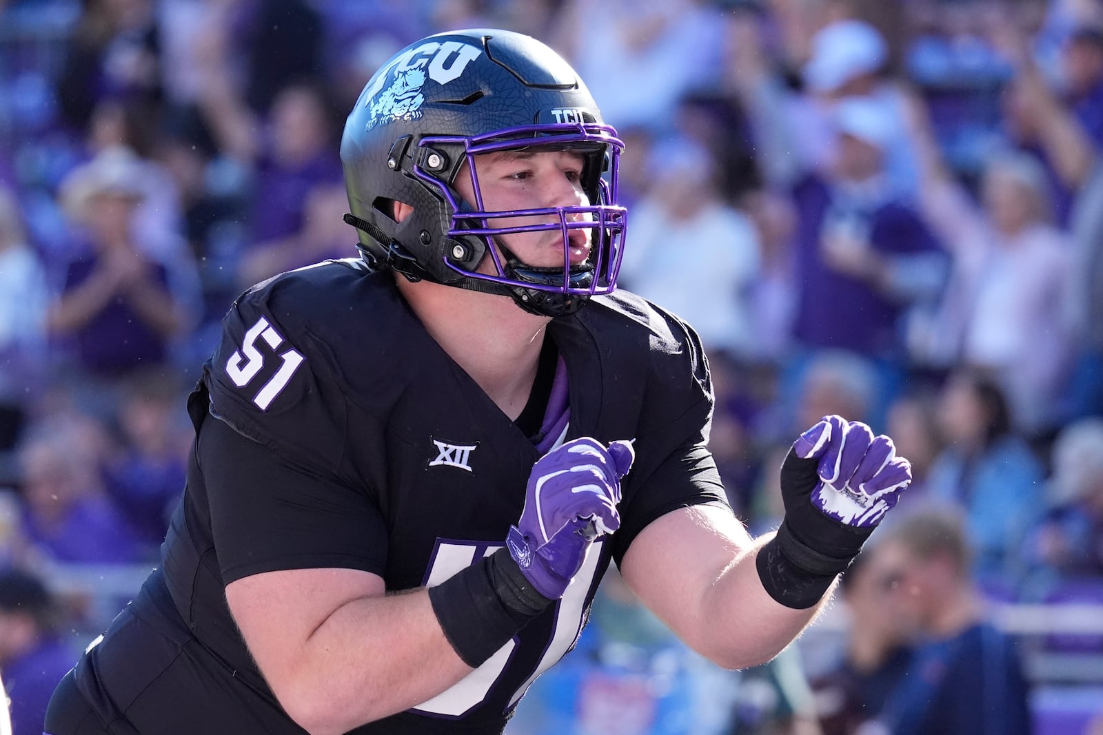 TCU offensive lineman Coltin Deery (51) celebrates a teammate's touchdown during the first half of an NCAA college football game against Arizona, Saturday, Nov. 23, 2024, in Fort Worth, Texas. (AP Photo/LM Otero)